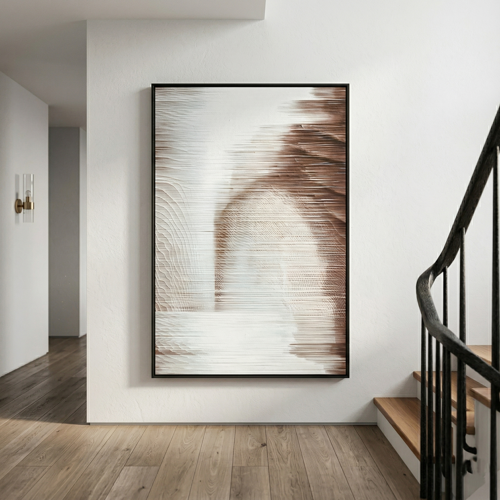 Striathen Sand & Beige Blur Textured Rope 3D Wall Art by Giant Sculptures displayed in a modern hallway with wood flooring and a curved staircase, showing horizontal rope lines in sand and beige tones within a slim black frame.