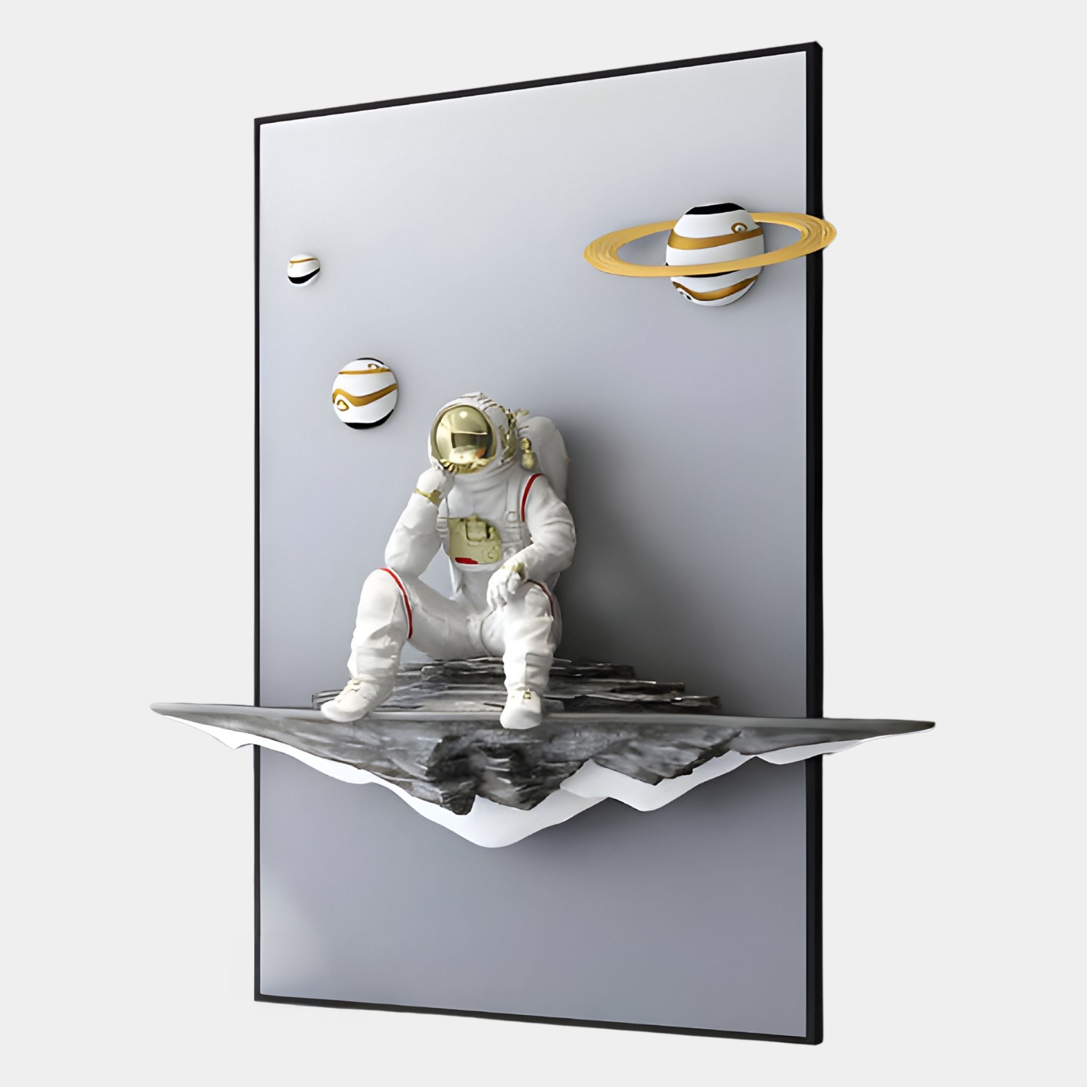 The White 3D Galaxy Astronaut Thinker Vertical Wall Art by Giant Sculptures features a resin astronaut on a rocky ledge within a rectangular frame, set against three planets and a gray background—a bold piece of cosmic decor.