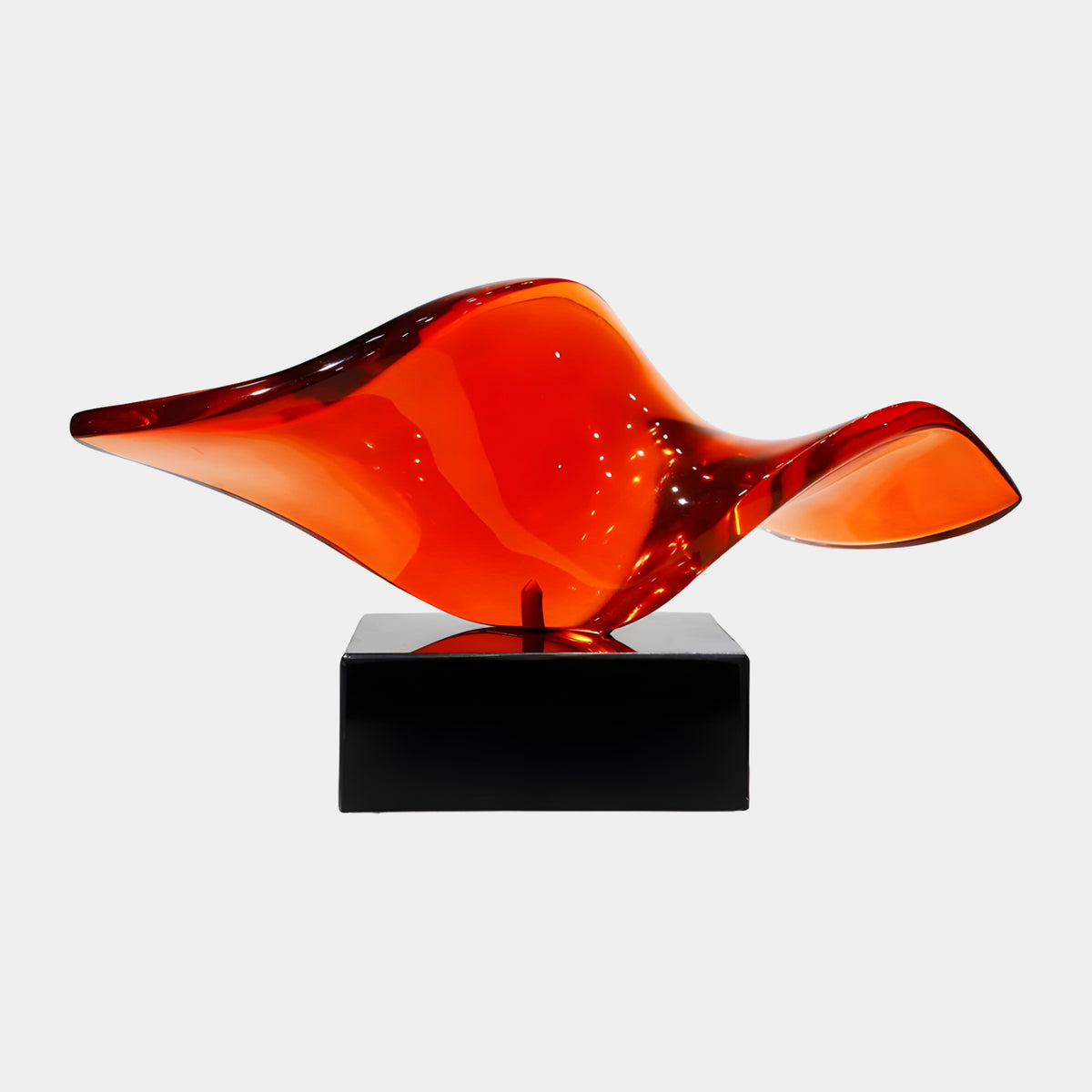 Red & Orange Twisted Saddle Resin Sculpture, 36cm, glossy wave-like form tapering to fine points, on a black rectangular base, plain white background.