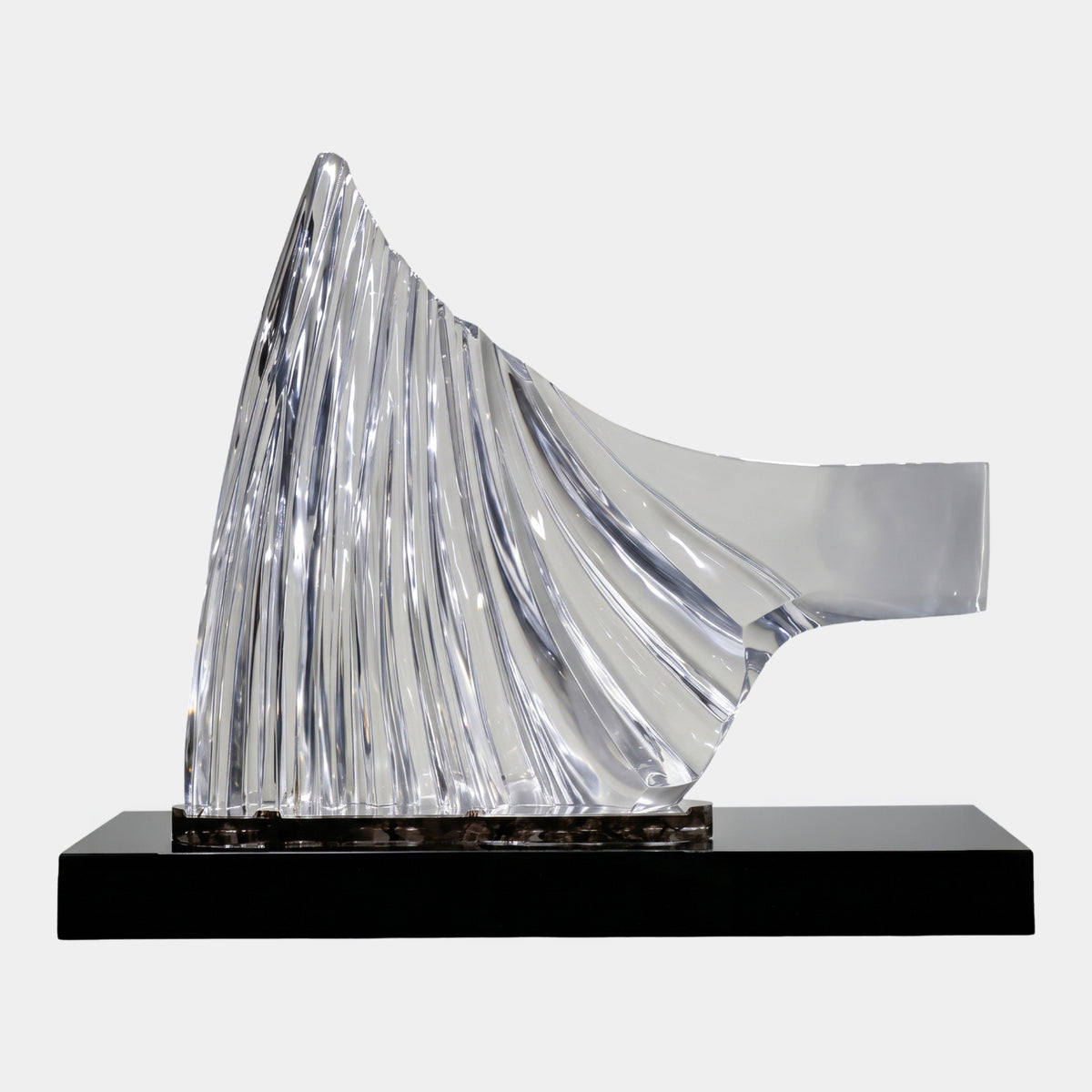 Clear Fluted Drapery Sheet Resin Sculpture, 120cm, with fluted peak rising from a smooth draped fold, set on a slim plate atop a black plinth against a white background.