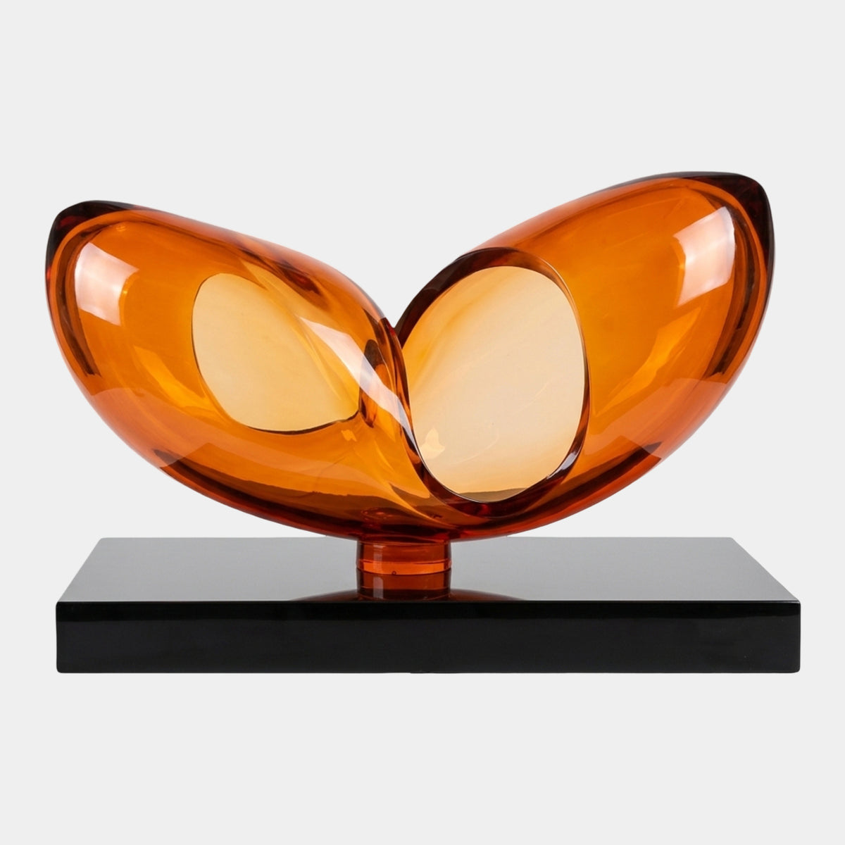 Large Orange Cleft Twin-Lobe Resin Sculpture (100cm) with two translucent amber lobes forming a V on a black marble base, set against a plain white background.