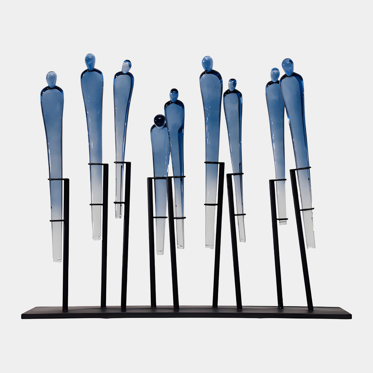 Blue Standing Figure Group Resin & Metal Sculpture, 60cm, nine slender figures fading blue-to-clear on black metal rods and flat base, plain white background.