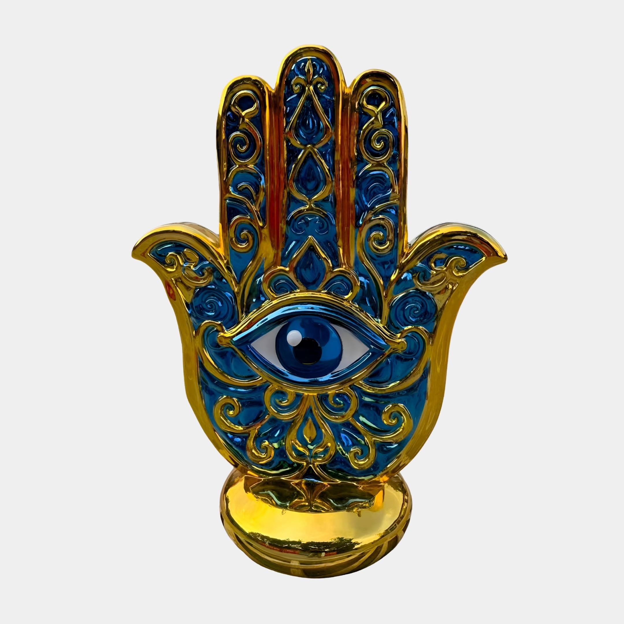 Giant Sculptures Golden Hamsa Hand Protection Sculpture 150cm in cobalt blue and gold fibreglass with central evil eye motif, shown front-on against a plain background.