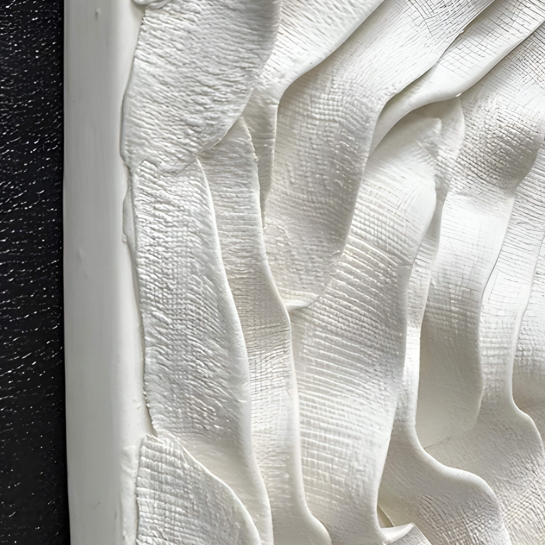 The Harmonia 3D Ceramic Rose Sculpture by Giant Sculptures features a textured white surface with wavy, layered patterns like brushstrokes. A black frame contrasts the intricate design, all encased in an acrylic box.