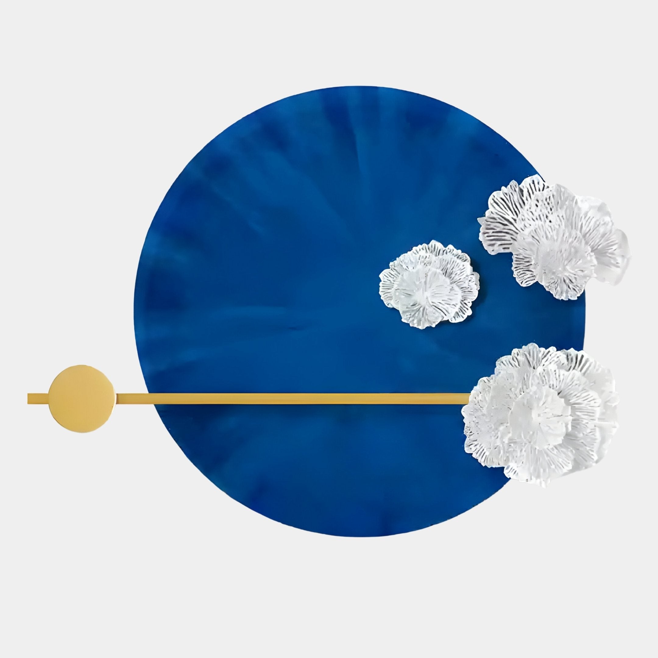 The Nova Floral Radiant Sapphire Blue Circular Wall Art by Giant Sculptures features a bold blue circle, white textured floral accents, and gold details—ideal for modern minimalist interiors.