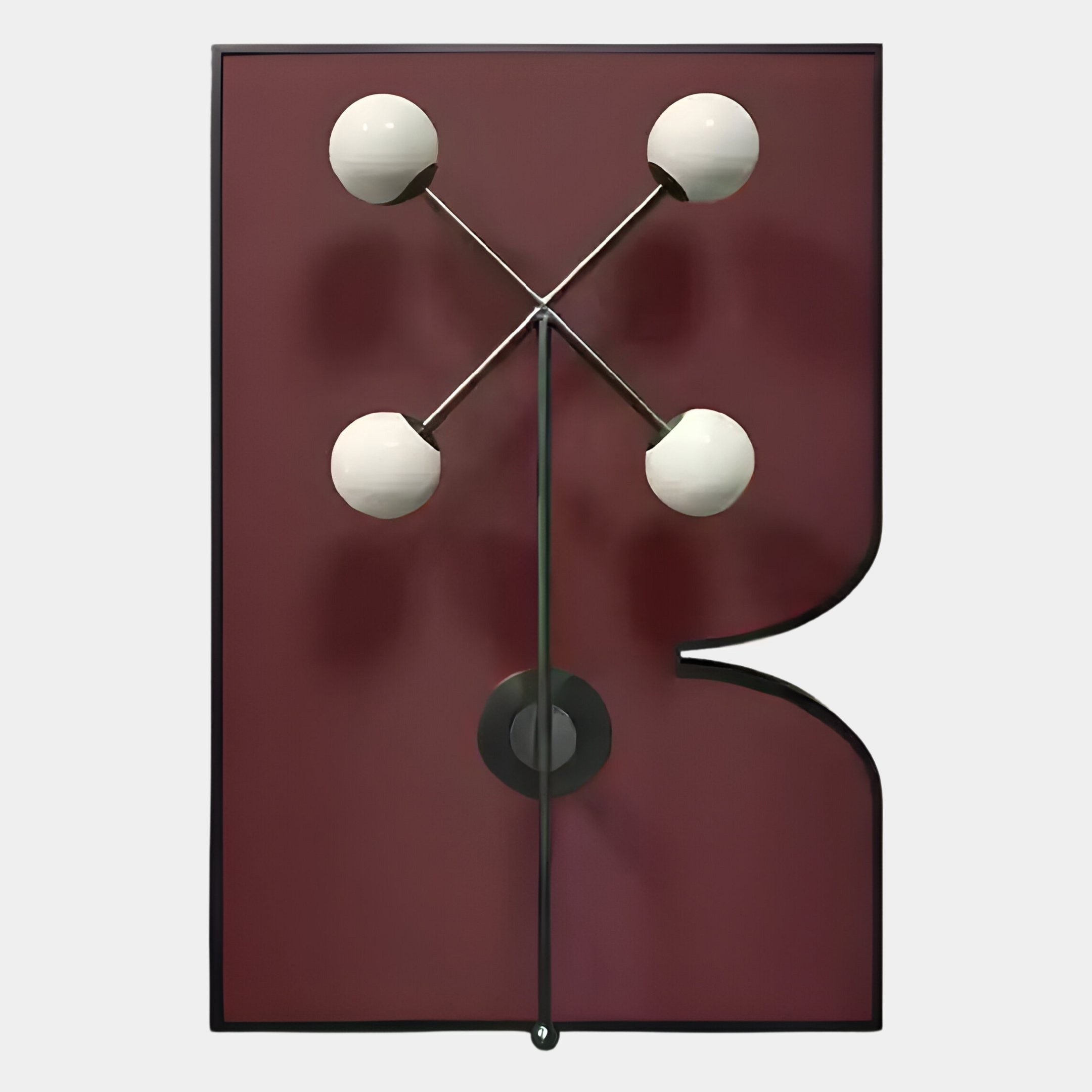 The Axial Elegance Burgundy Symmetrical Metal Wall Art by Giant Sculptures features a maroon geometric rectangle with a right-side curve cut-out and four white globe bulbs in an X, connected by metal rods—perfect for modern interiors.