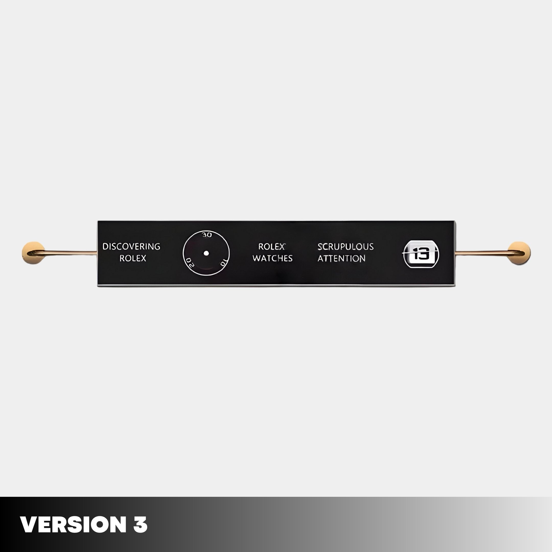 The Visario Rolex Inspired Luxury Metal Wall Art by Giant Sculptures features a minimalist black horizontal panel with gold rod ends, central dial, date indicator, “DISCOVERING ROLEX,” and “VERSION 3” text—perfect luxury home decor or collectible wall art.