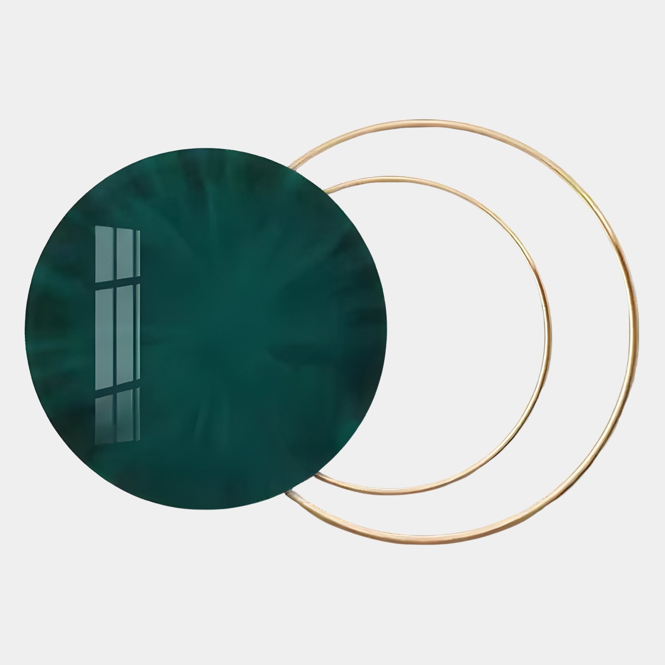 The Eclipse Luxe Velvet Emerald Circular Ring Wall Art by Giant Sculptures features a dark green circular disc with a reflective window pattern overlapping thin gold rings, creating a contemporary statement piece.