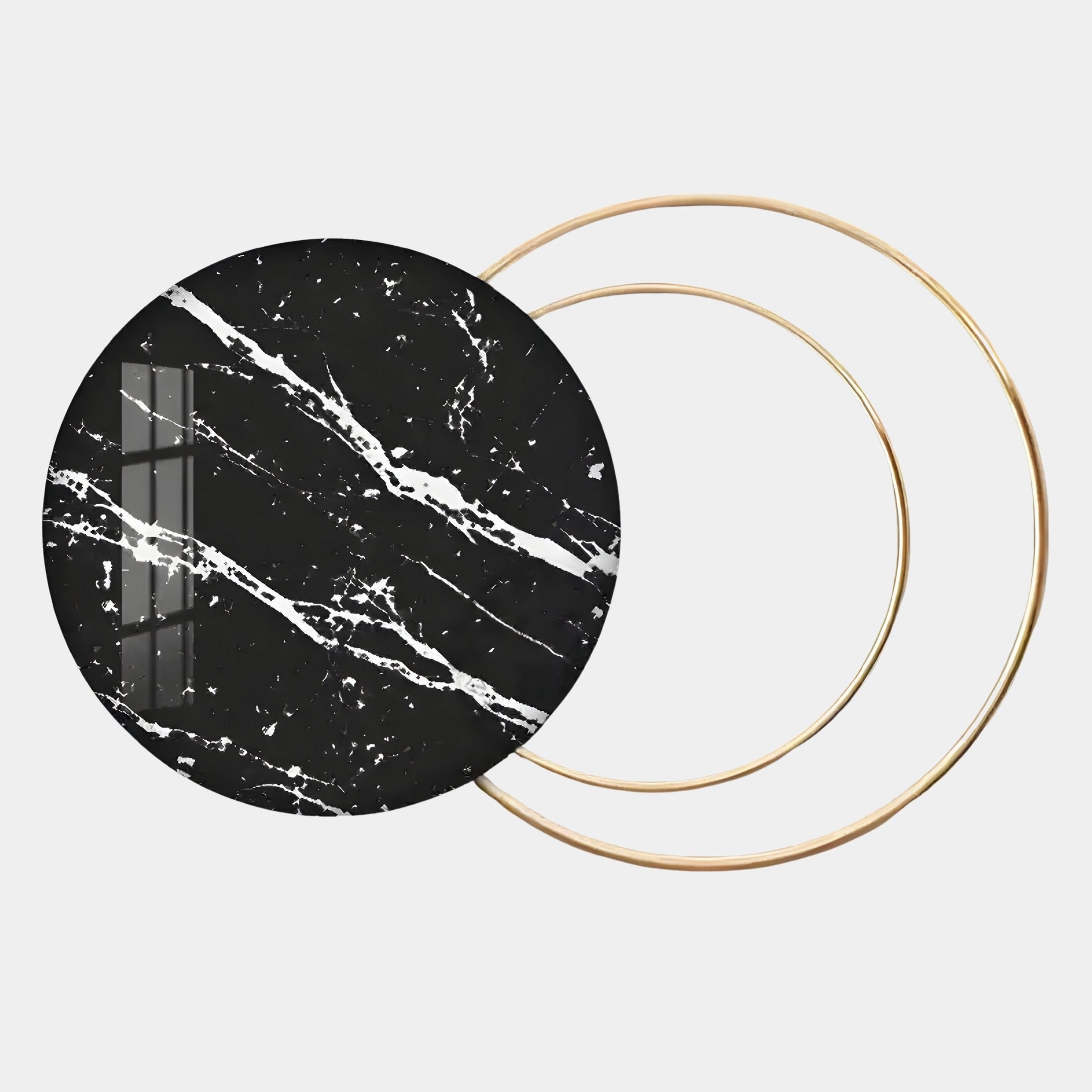 The Eclipse Luxe Black Noir Marble Circular Ring Wall Art by Giant Sculptures features a round marble disc with white veins overlapping two slim gold rings, its modern elegance highlighted by window reflections on a plain white background.