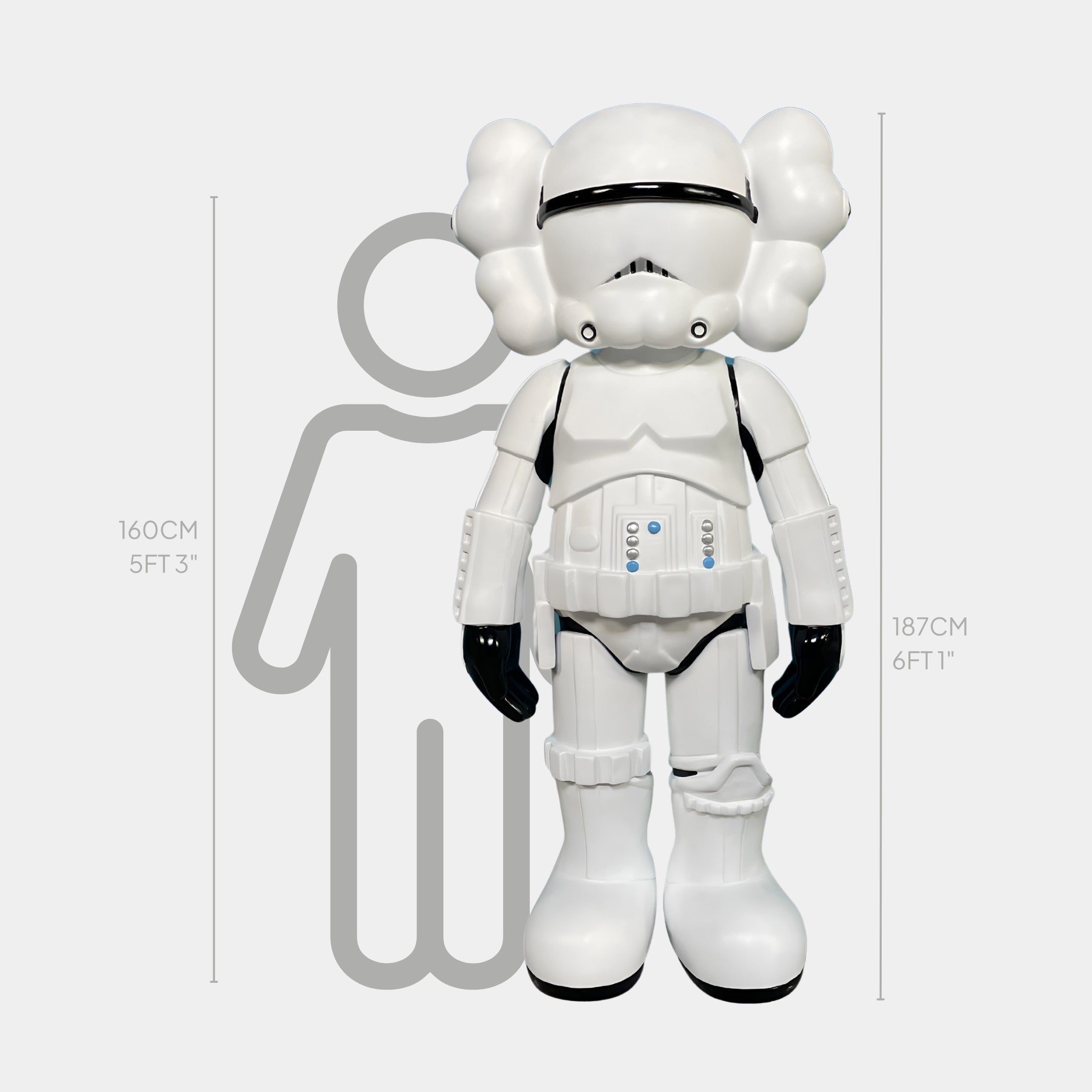 The Black & White Iconify Enforcer Sculpture by Giant Sculptures, crafted from high-grade resin, stands 187 cm tall in white armor beside a gray 160 cm outline. The background is light gray.