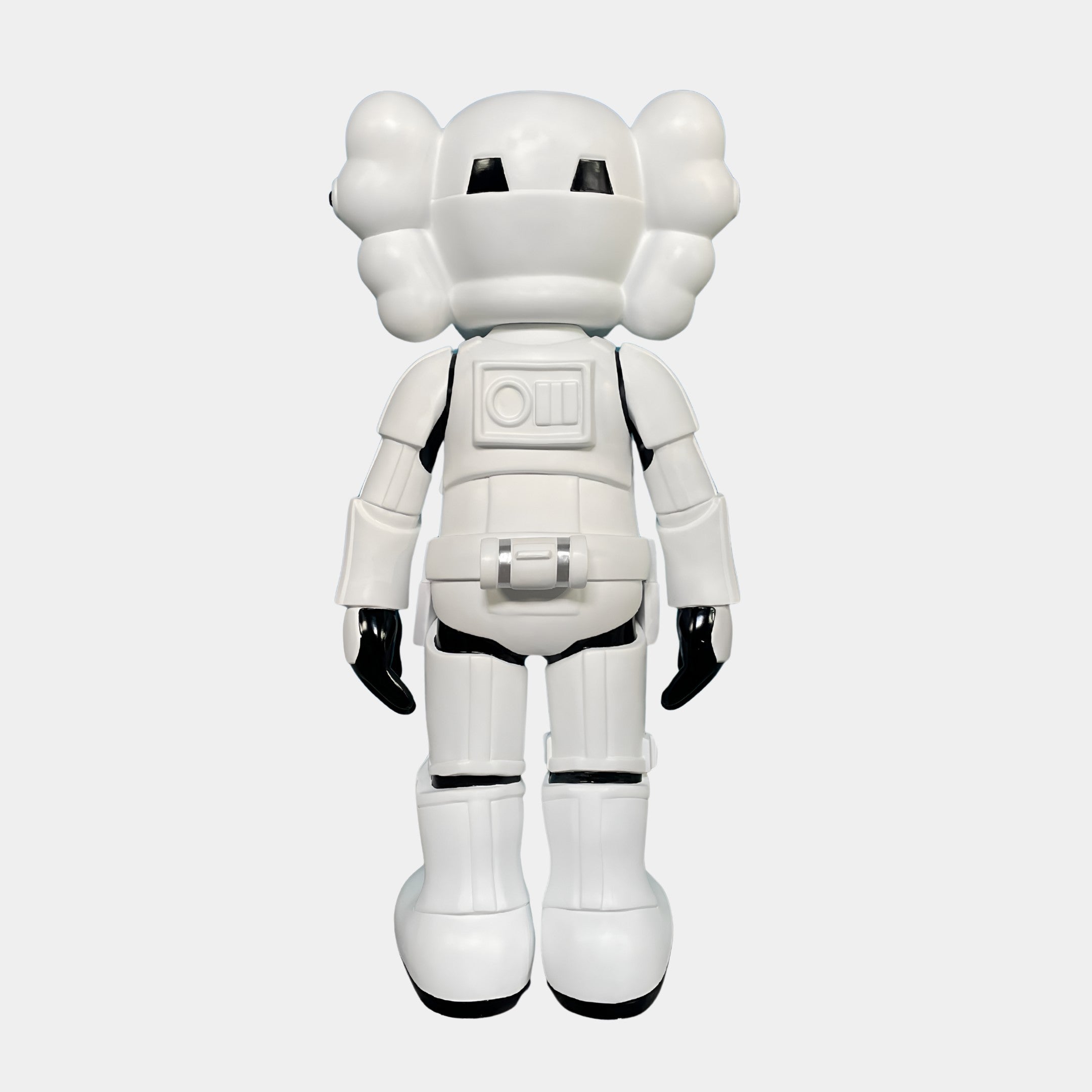 The Black & White Iconify Enforcer Figure (26cm) by Giant Sculptures features a white cartoon robot with black gloves and cloud-shaped ears, shown from the back on a plain light background—ideal for modern art collections.