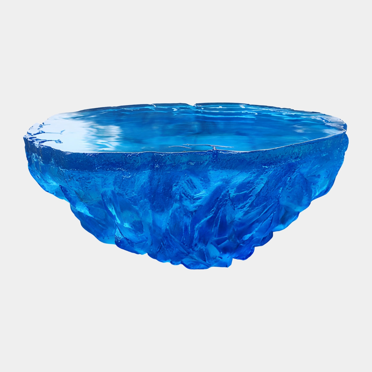 Blue Hewn Resin Bowl with Polished Basin - 90cm, chiseled exterior facets and rippled polished top with an irregular rim, shown on a plain light grey background.