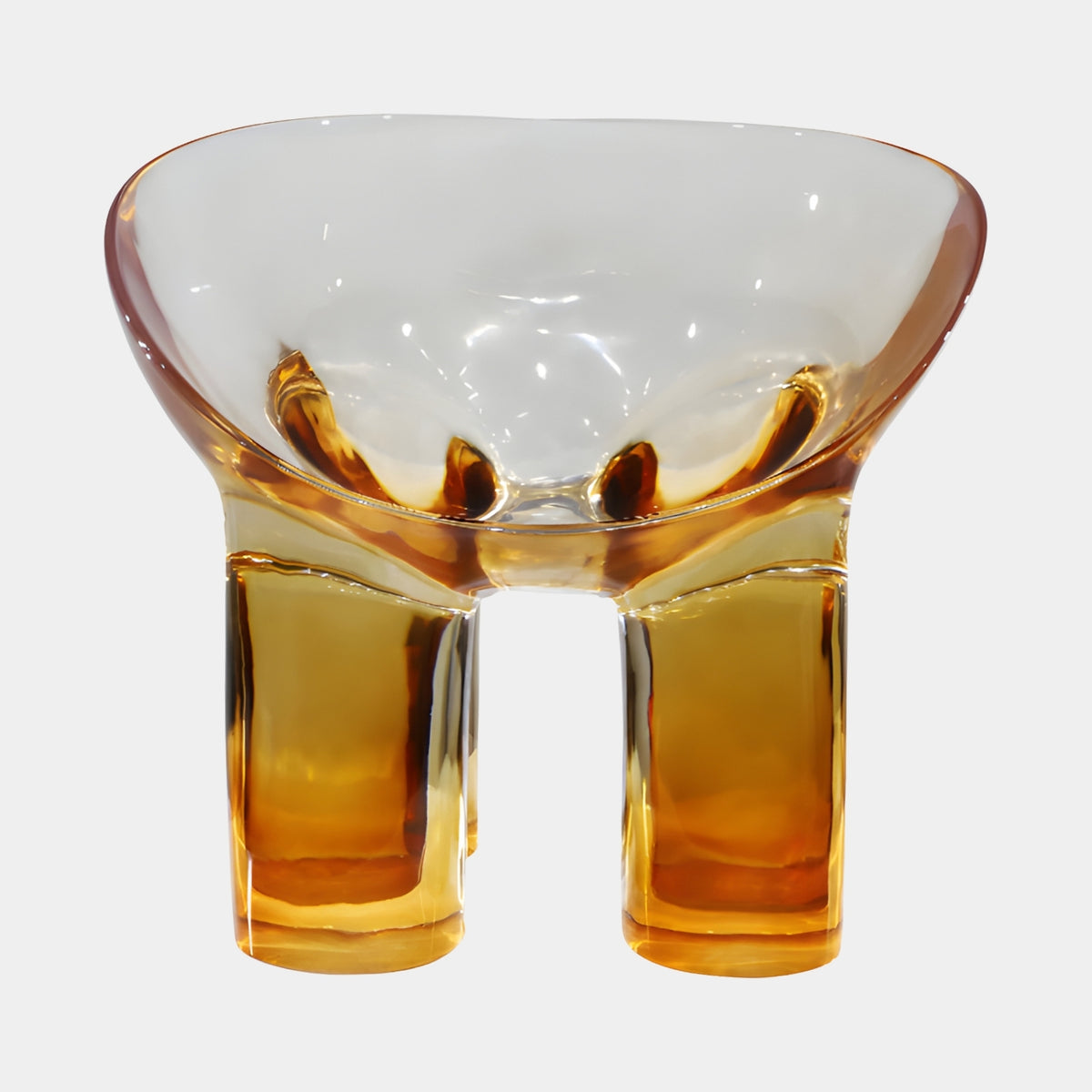 Amber Bowl Seat Cast Resin Lounge Chair (64cm) by Giant Sculptures, translucent amber resin bowl seat on four stout legs, shown on a plain white background.