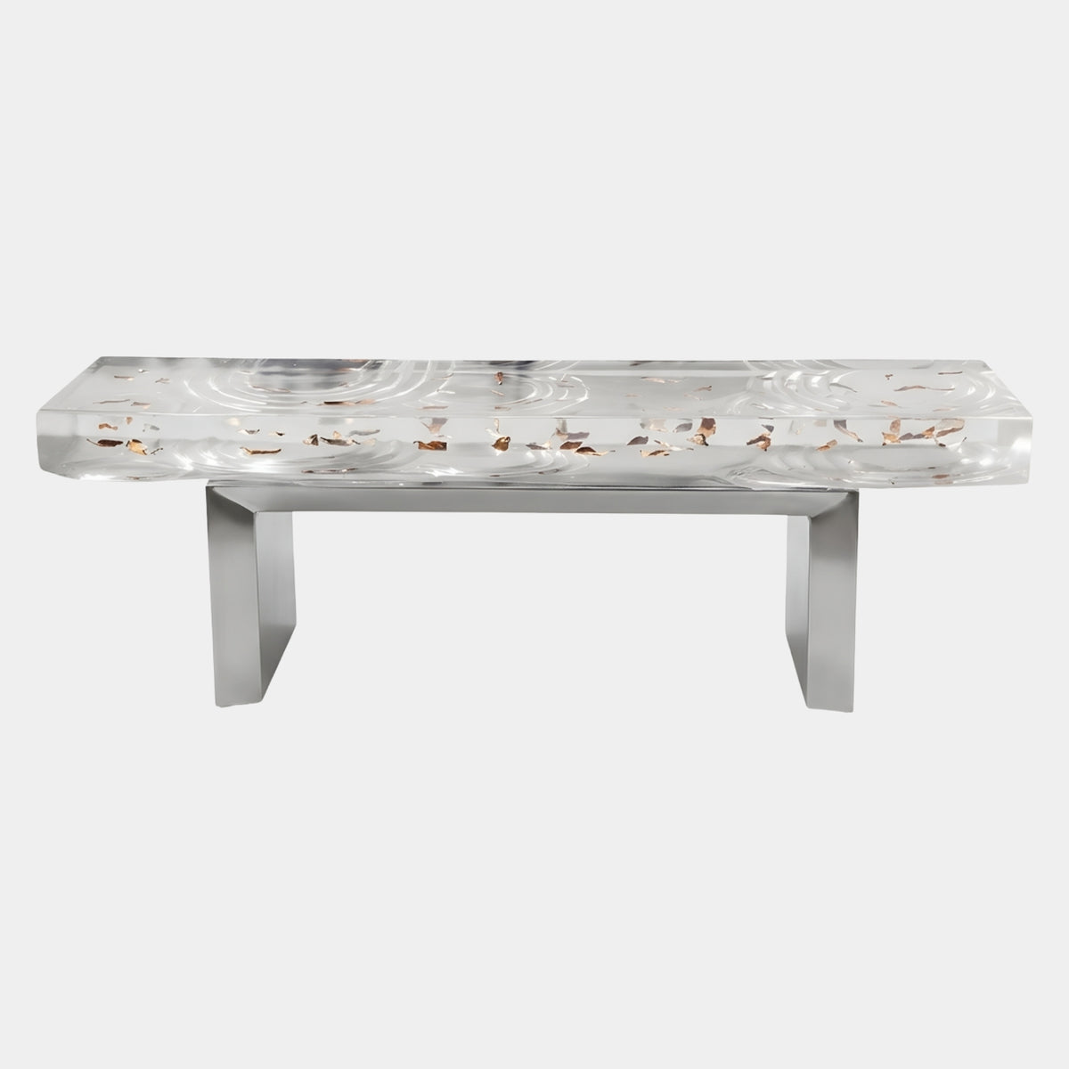 Clear Leaf Inclusion Resin Bench - 140cm with copper-toned leaves suspended in a rippled clear resin top, set on a squared stainless steel frame, shown on a plain white background.