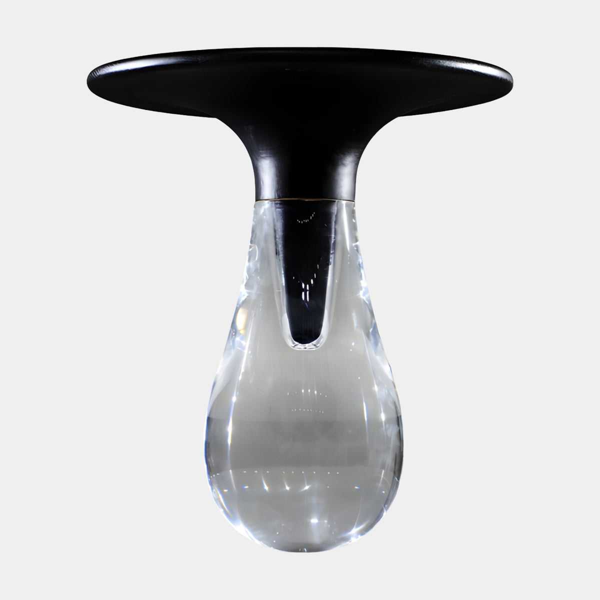Clear Teardrop Base Black Disc Top Side Table - 50cm, with a clear resin teardrop base and a matt black disc top, shown on a plain white background.