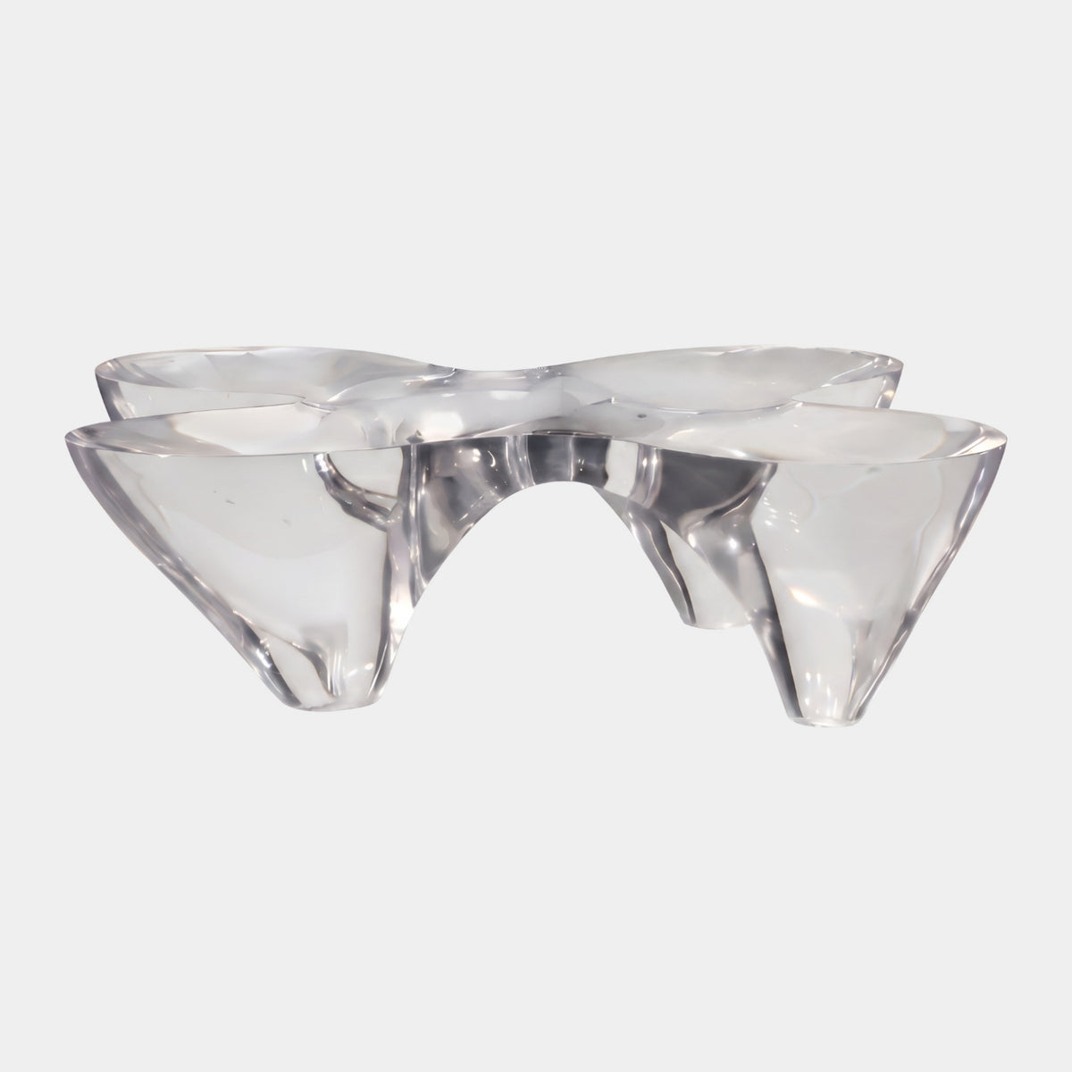 Clear Four Cone Cast Resin Low Table (110cm) by Giant Sculptures, four fused translucent cones forming a lobed top on narrow feet, shown on a plain white background.
