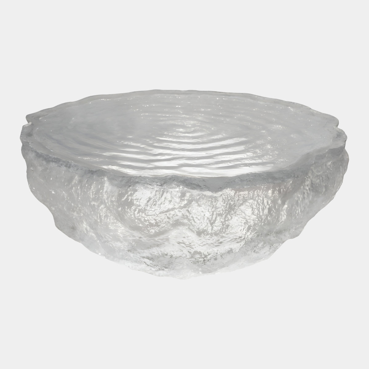 Clear Rippled Top Broken Ice Low Table (130cm) by Giant Sculptures, oval clear resin form with concentric rippled rings on top and a faceted, chipped base, shown on a plain white background.