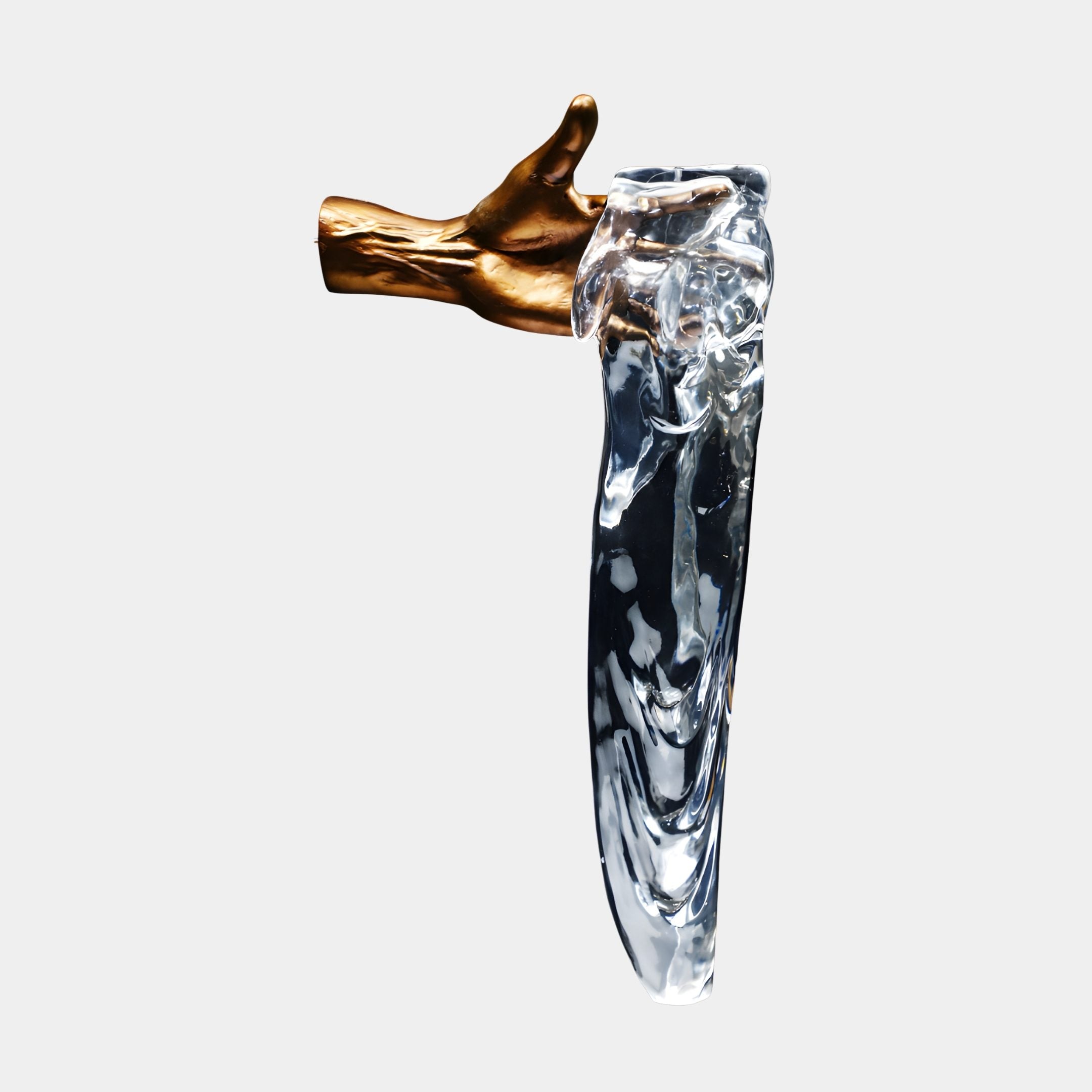 Gold Hand Holding Clear Resin Drip Wall Sculpture by Giant Sculptures, a gilded hand grasping a long transparent flowing drip, shown against a plain background.