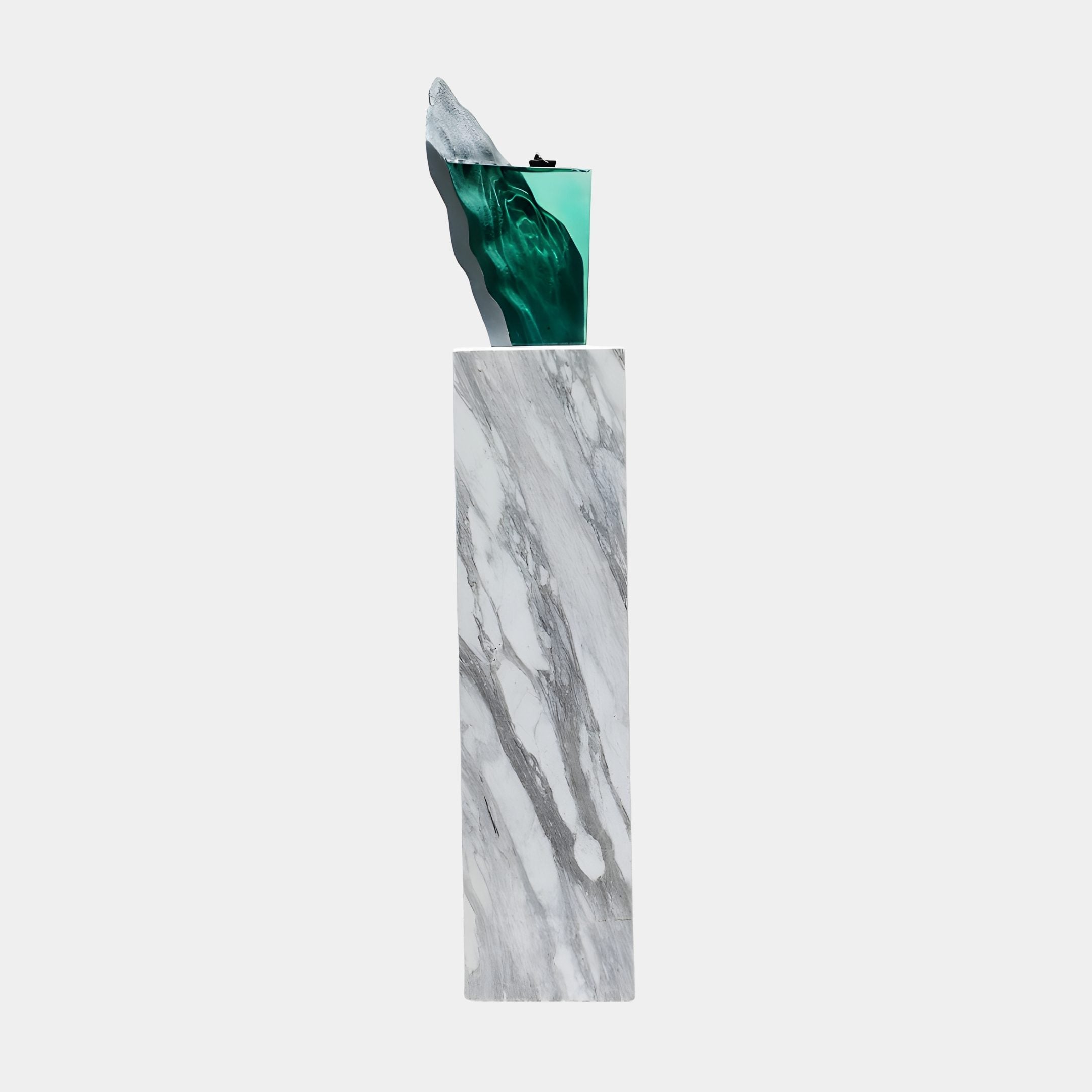 Clear Resin Glacial Wave Grey Peak Sculpture by Giant Sculptures, featuring a transparent green wave curling beside a grey peak atop a tall marble column.