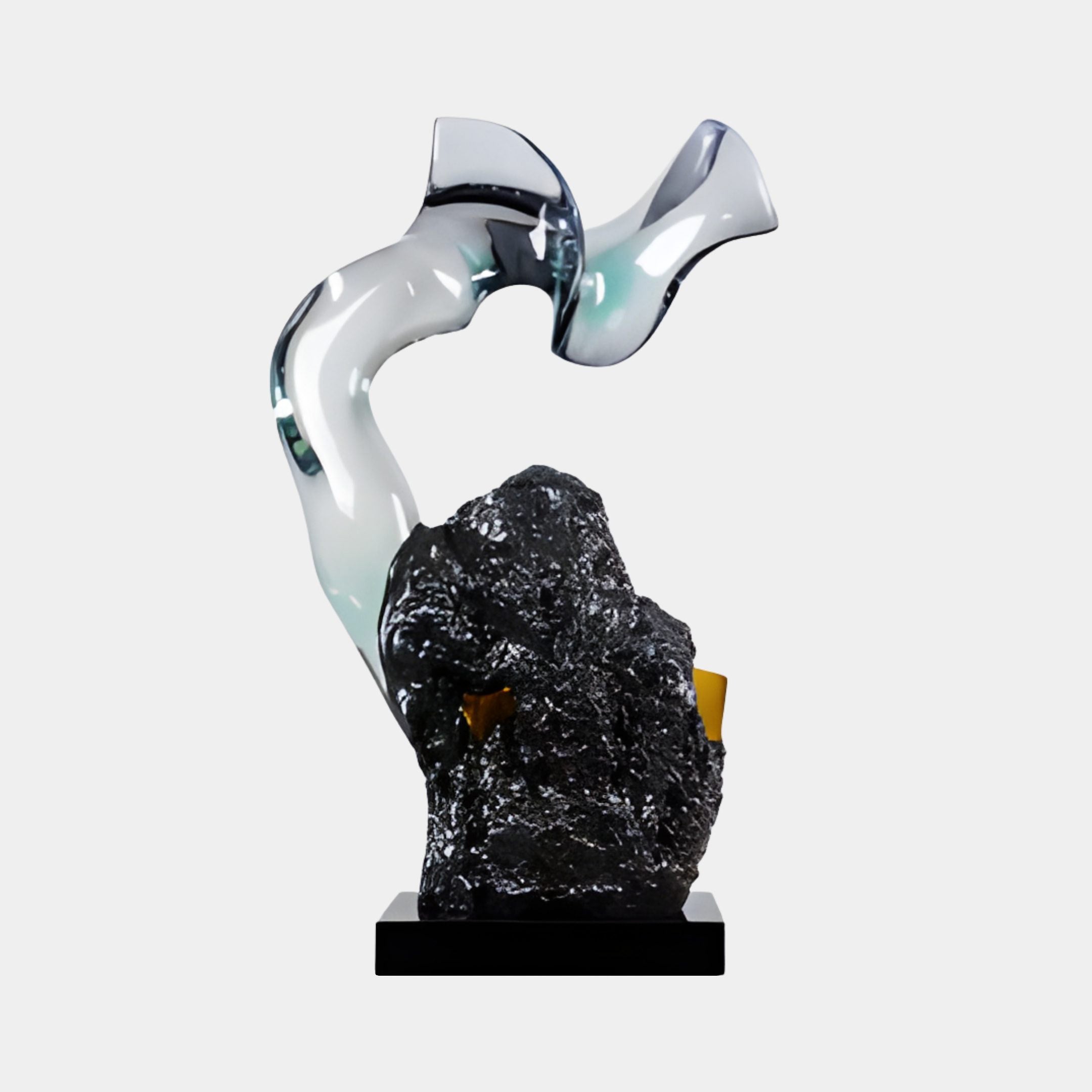 Smoke Grey Translucent Fluid Obsidian Resin Sculpture by Giant Sculptures, glossy ribbon curling above a rugged black rock base on a plain background.