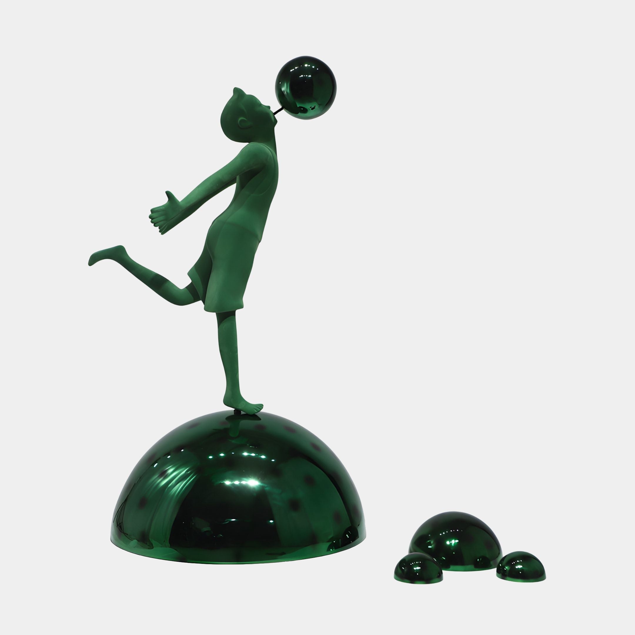Green Bubble Boy Figurine Globe Resin Sculpture by Giant Sculptures, 150cm, balancing on one leg atop a glossy domed base with smaller domes beside it.