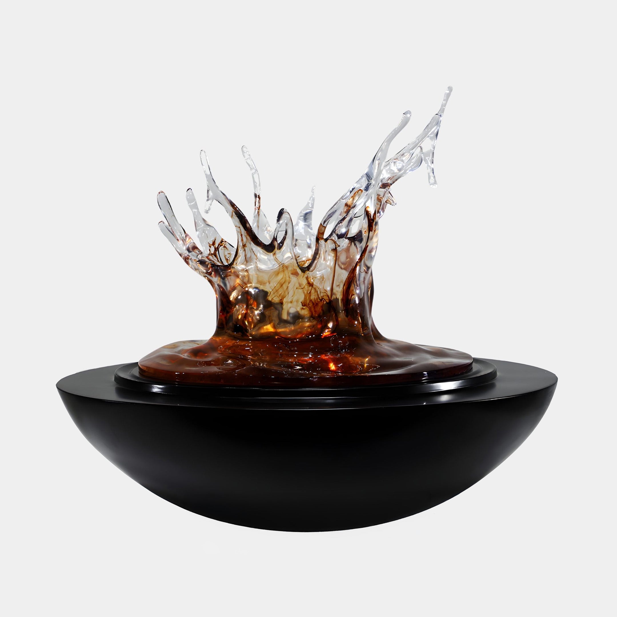 Giant Sculptures Amber Resin Water Crown Splash Sculpture 80cm with translucent amber and clear spikes frozen mid-splash atop a glossy black bowl base, on a plain background.