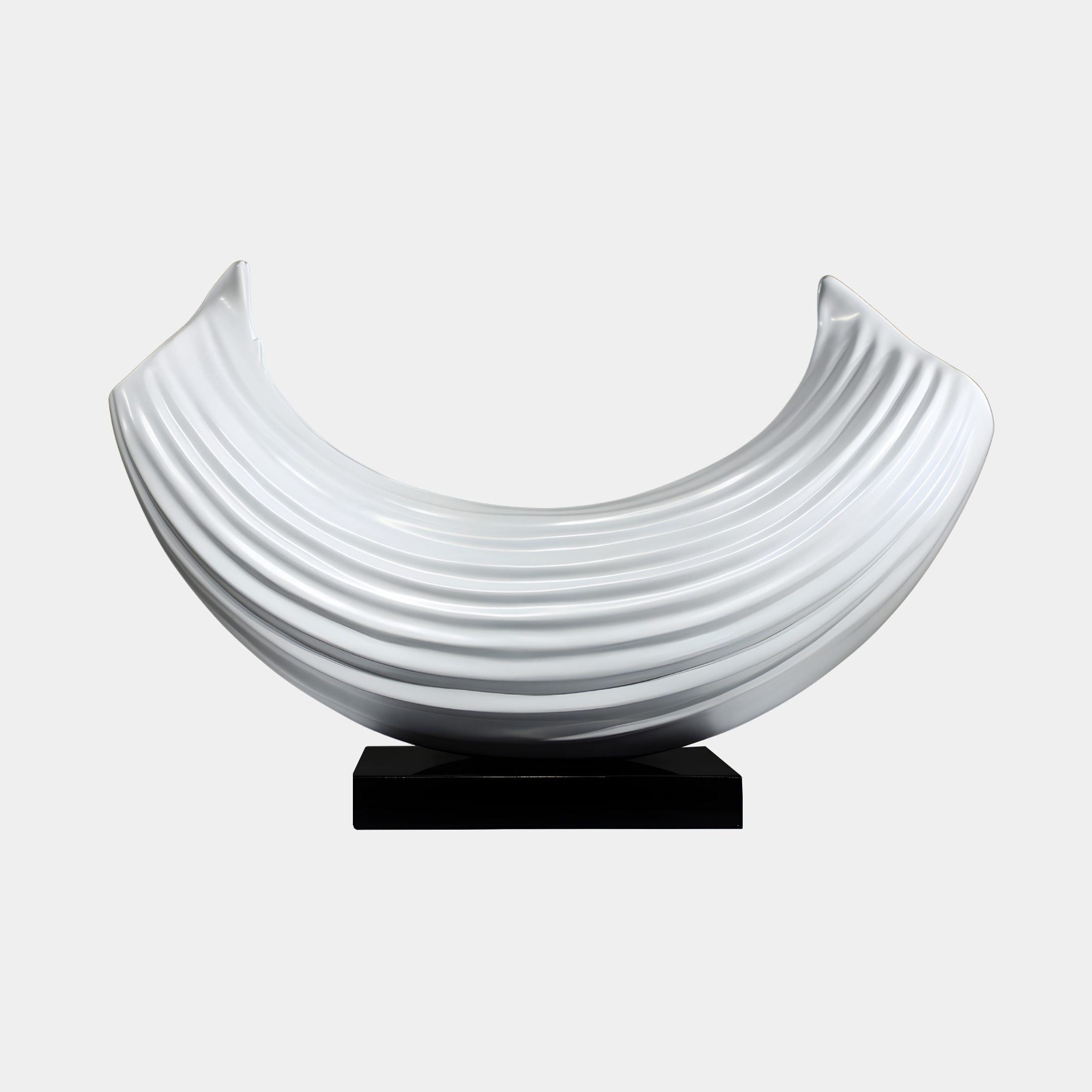 White Ribbed Crescent Moon Abstract Resin Sculpture by Giant Sculptures, fluted curved form on a low black base, shown against a plain light background.