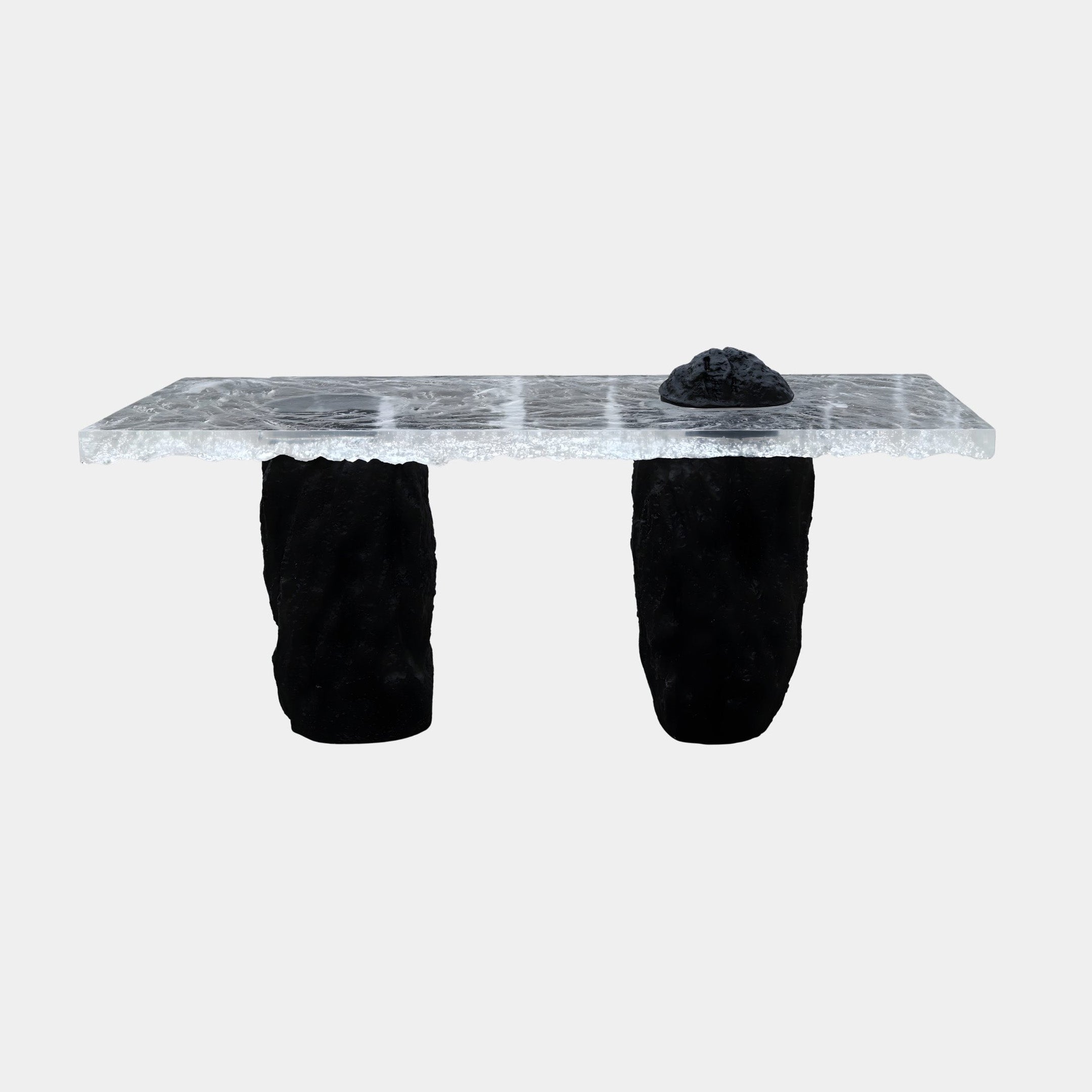 Giant Sculptures Textured Ice Slab on Black Rock Resin Console Bench 180cm with a frosted clear resin top, small black rock accent, and two rugged black legs.
