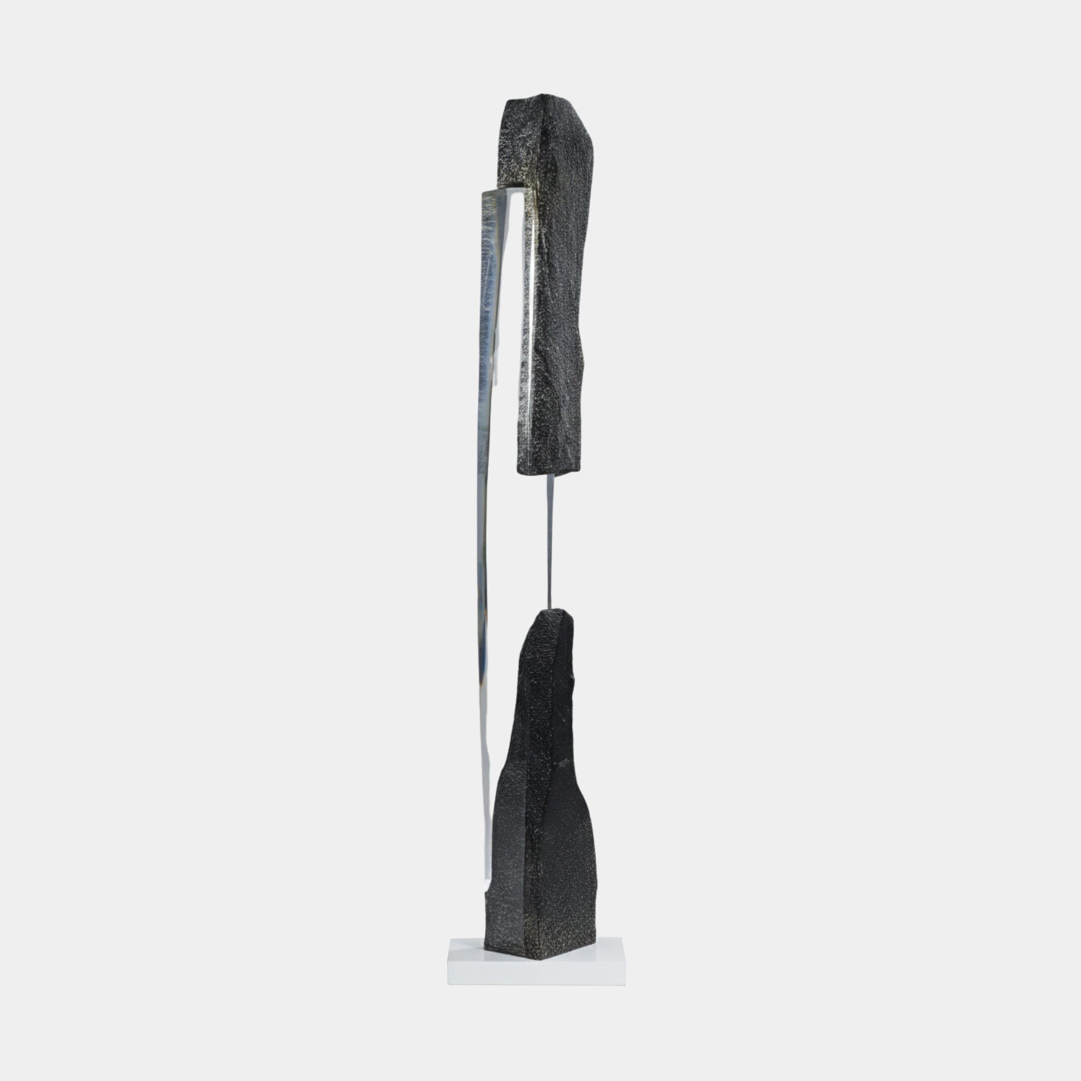 Giant Sculptures' Black Split Peak & Clear Resin Inner Pillar Sculpture, 199cm, with textured dark stone halves divided by a clear resin pillar on a white base.