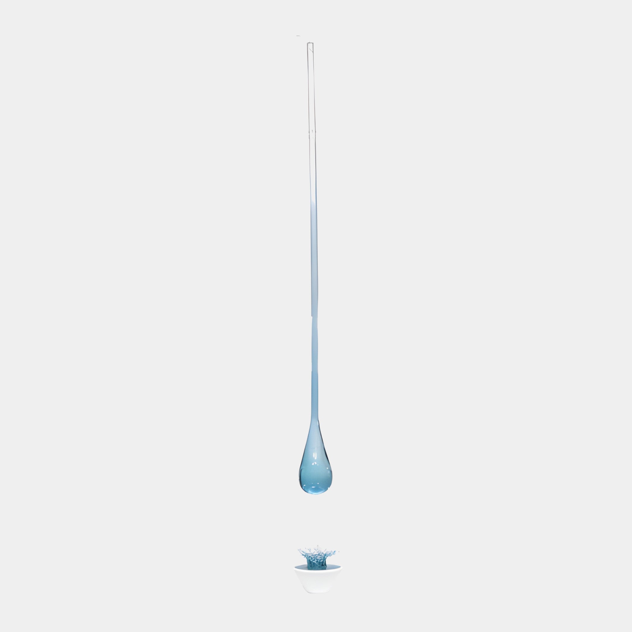 Blue Floating Resin Teardrop & White Splash Sculpture 190cm by Giant Sculptures, suspended droplet above a white bowl with rising blue splash, plain background.
