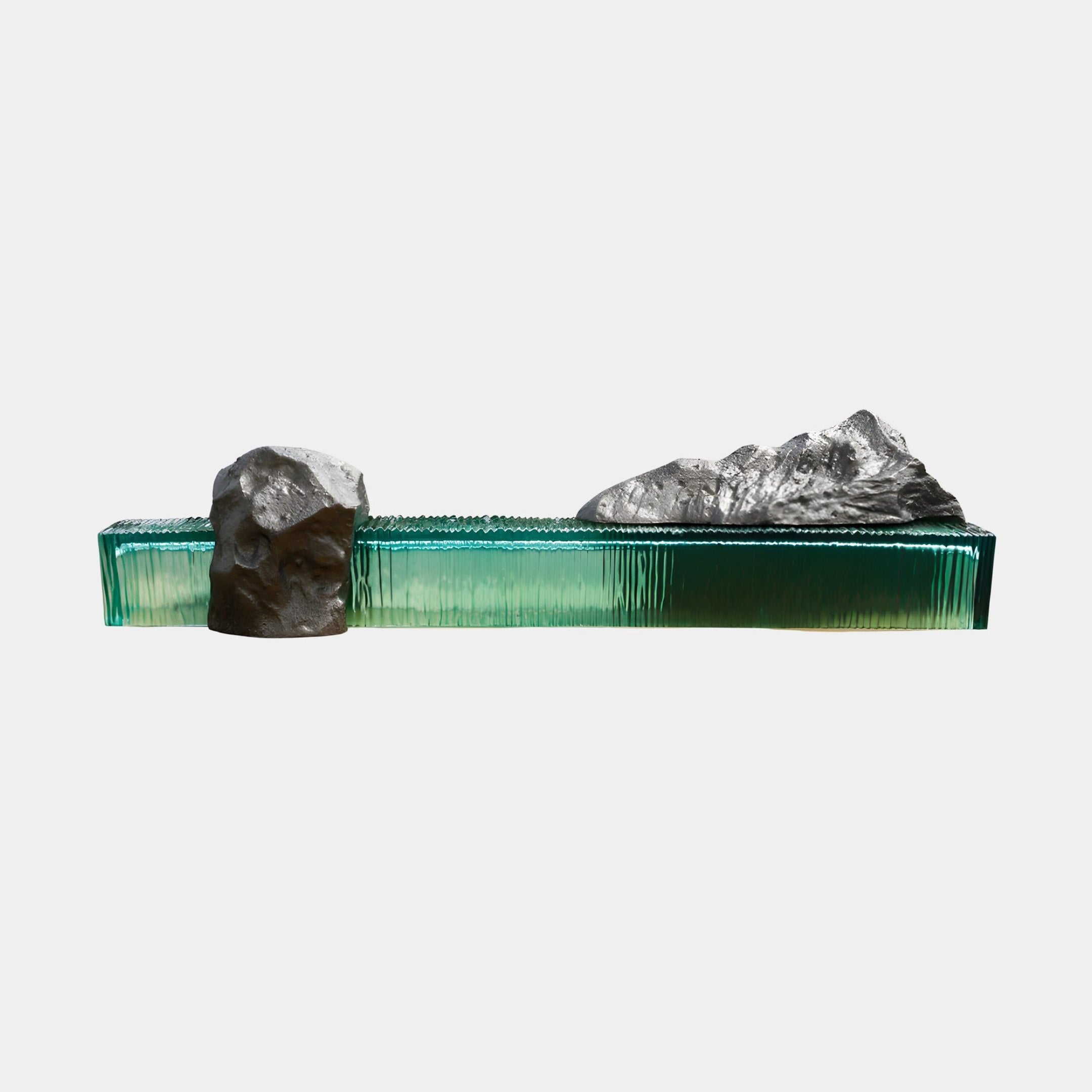 Translucent Emerald Resin Ribbed Glass Pillar Sculpture by Giant Sculptures, a horizontal ribbed green resin base topped with two rugged grey rock forms.