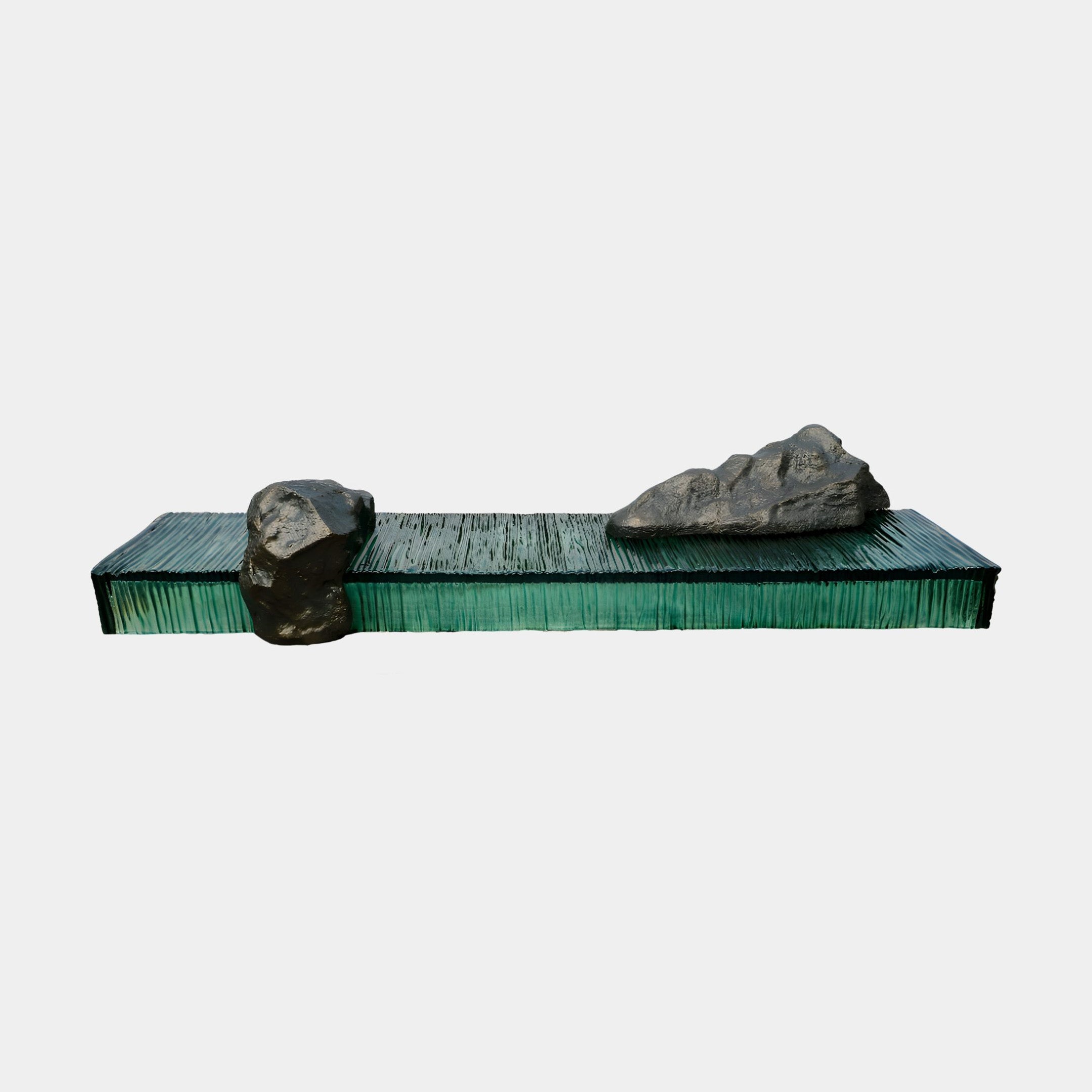 Giant Sculptures Deep Green Rippled Resin & Black Rock Landscape Console at 260cm, side view showing the rippled emerald resin slab with two black rocks on a white background.