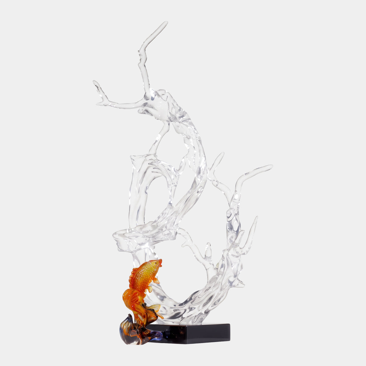 Clear Breaking Wave with an Amber Koi, 120cm, clear resin wave sculpture with curling spray and a leaping amber koi on a black base, plain white background.