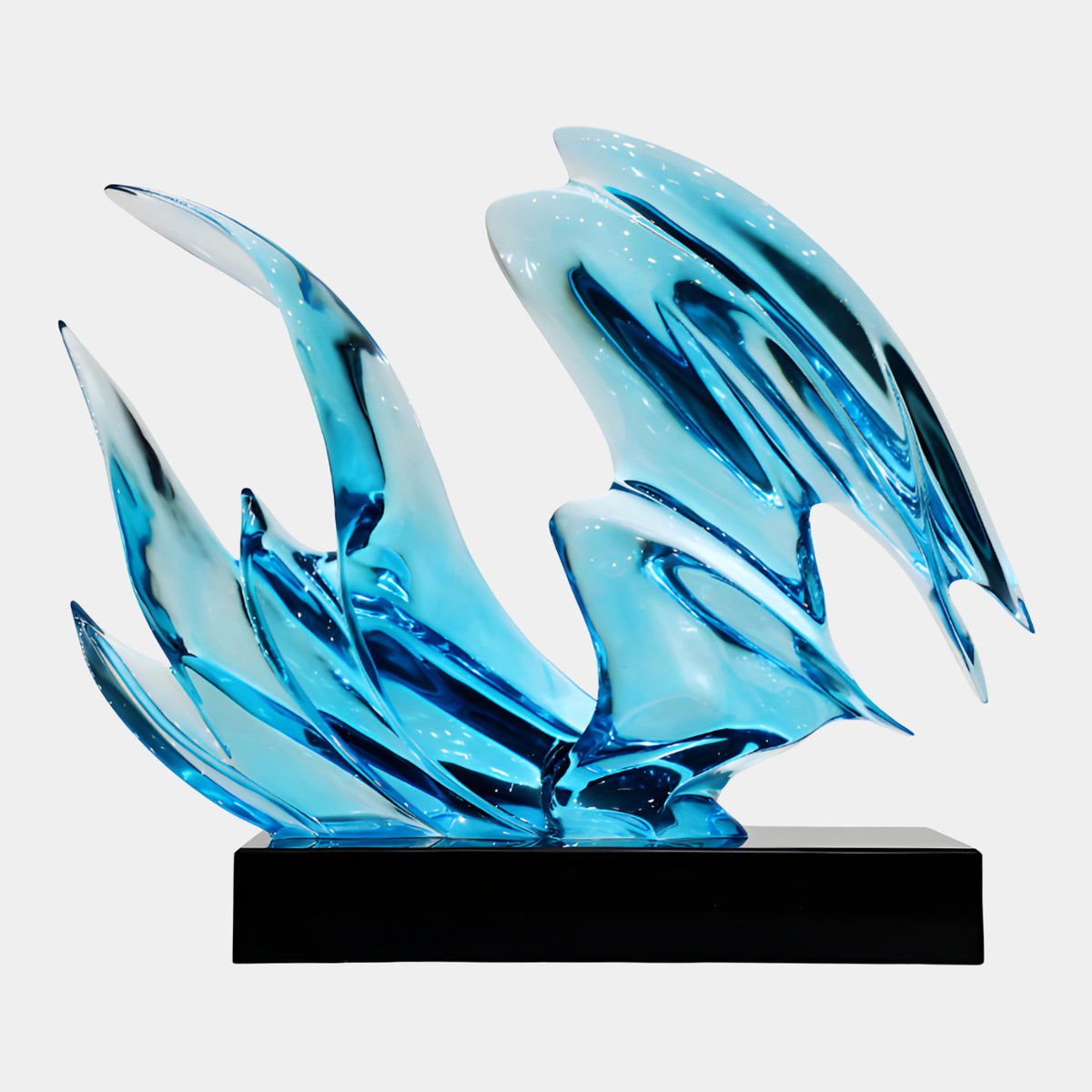 Turquoise Swept Blade Wave Resin Sculpture, 58cm, with curling blade-like forms in turquoise and marine blue on a black rectangular base against a plain white background.
