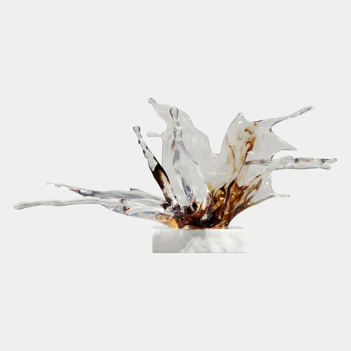 Brown & Clear Sweeping Splash Resin Sculpture, 77cm, with wide clear resin arms and dark brown streaks at the base, on a marble stand against a plain white background.