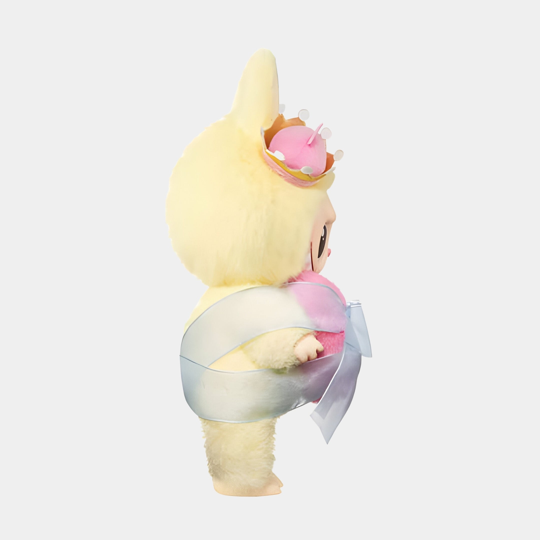 The Monster Checkmate Heart Labubu Sculpture by Giant Sculptures (160cm) features a collectible art toy in a fluffy yellow outfit, large bunny ears, pink crown, shiny white sash with bow, shown in profile facing right.