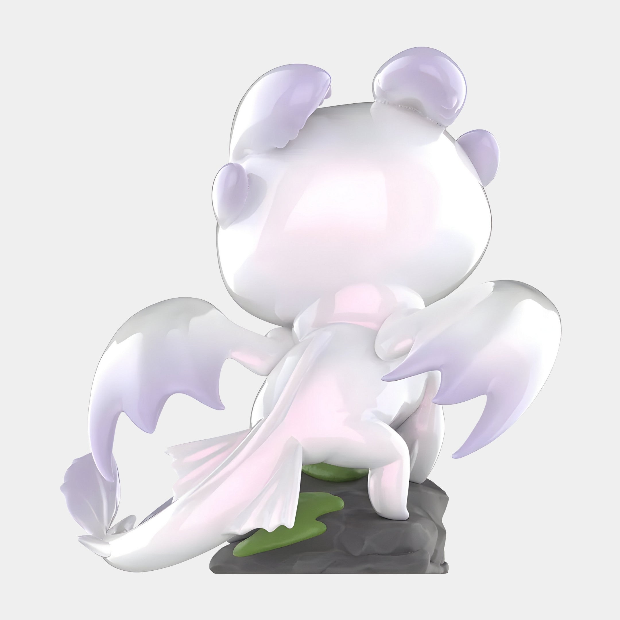 The Giant Sculptures Dragon Bond Light Fury Labubu Sculpture (100cm) is a glossy white figurine with light purple accents, large wings, rounded ears, and a long tail, perched on a gray rock and viewed from behind.