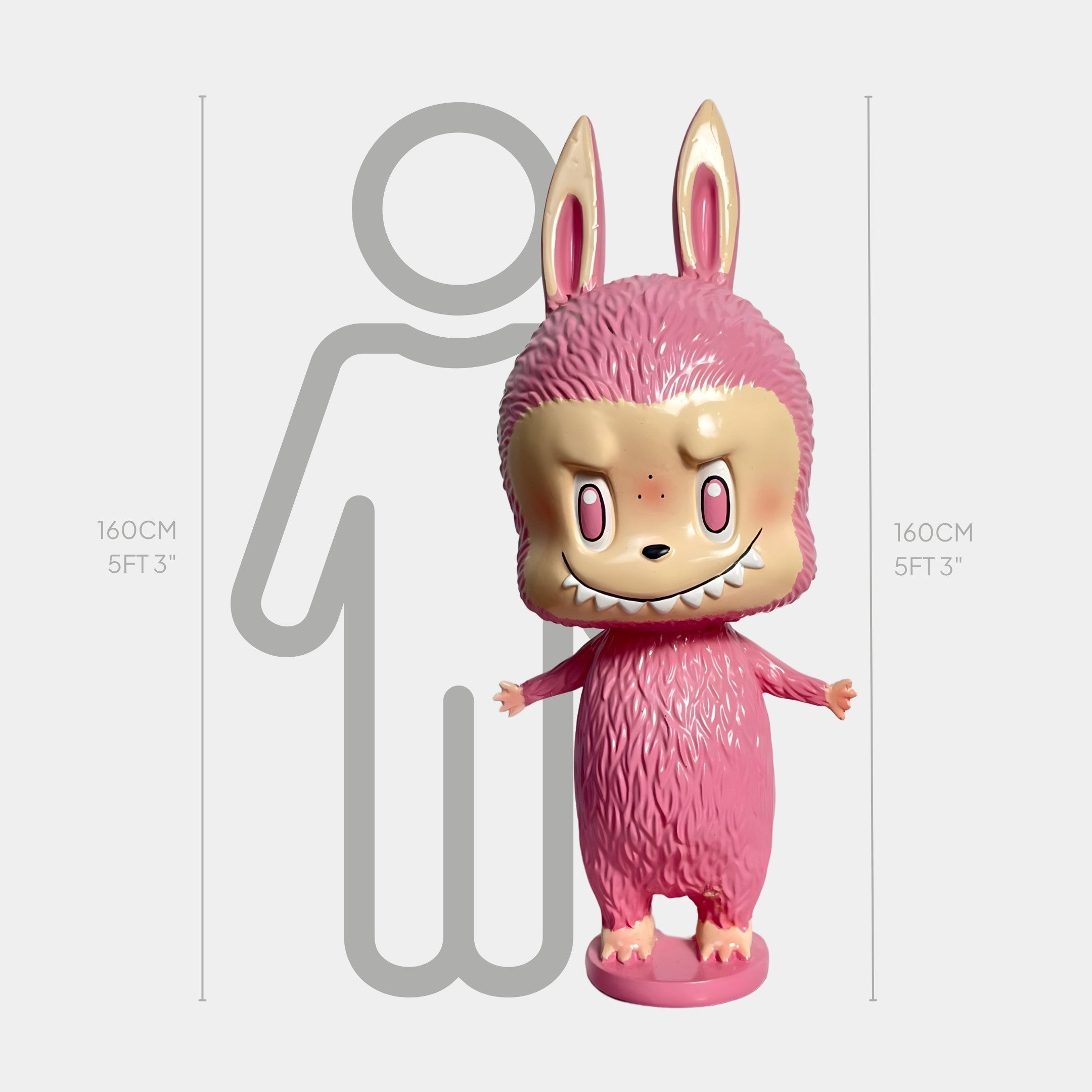 The Giant Sculptures’ The Little Monster Pink Labubu Sculpture - 160cm is a large, hand-painted pink fibreglass figure with a mischievous grin, shown beside an outline of a person to highlight its impressive height.