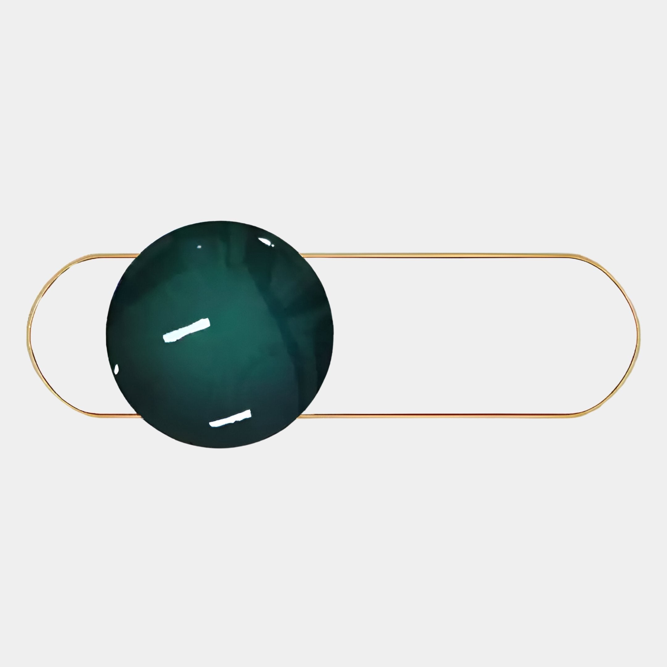 A dark green, glossy sphere inspired by Giant Sculptures Vitreon 3D Teal Crystal Porcelain With Gold Frame Wall Art overlaps a thin gold oval outline on light gray, with white highlights reflecting off its surface.