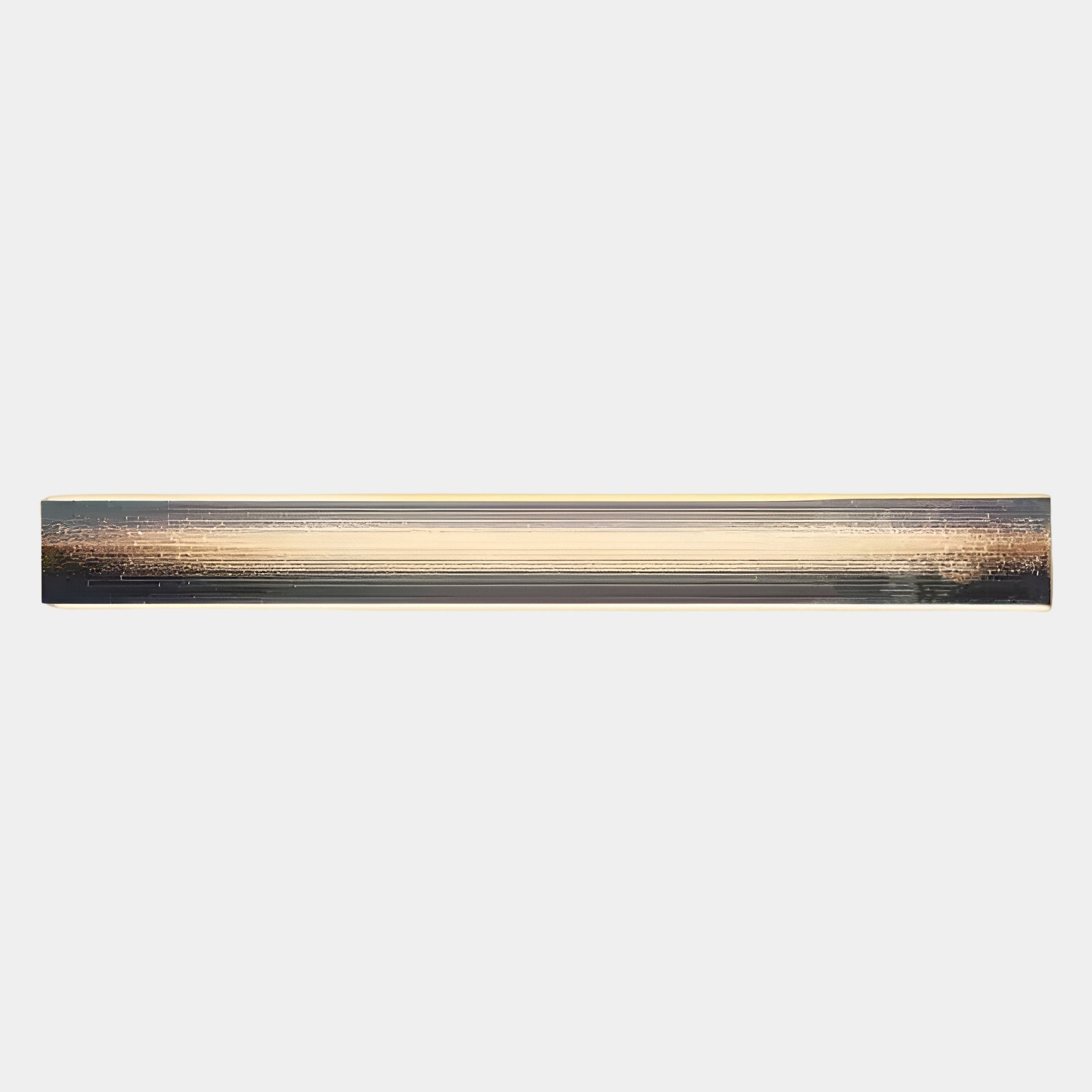 A metallic, cylindrical rod with horizontal grooves and a slightly reflective surface, echoing the sleek style of Giant Sculptures’ Radiance Amber Dusk Canvas LED Wall Art, set against a plain white background.
