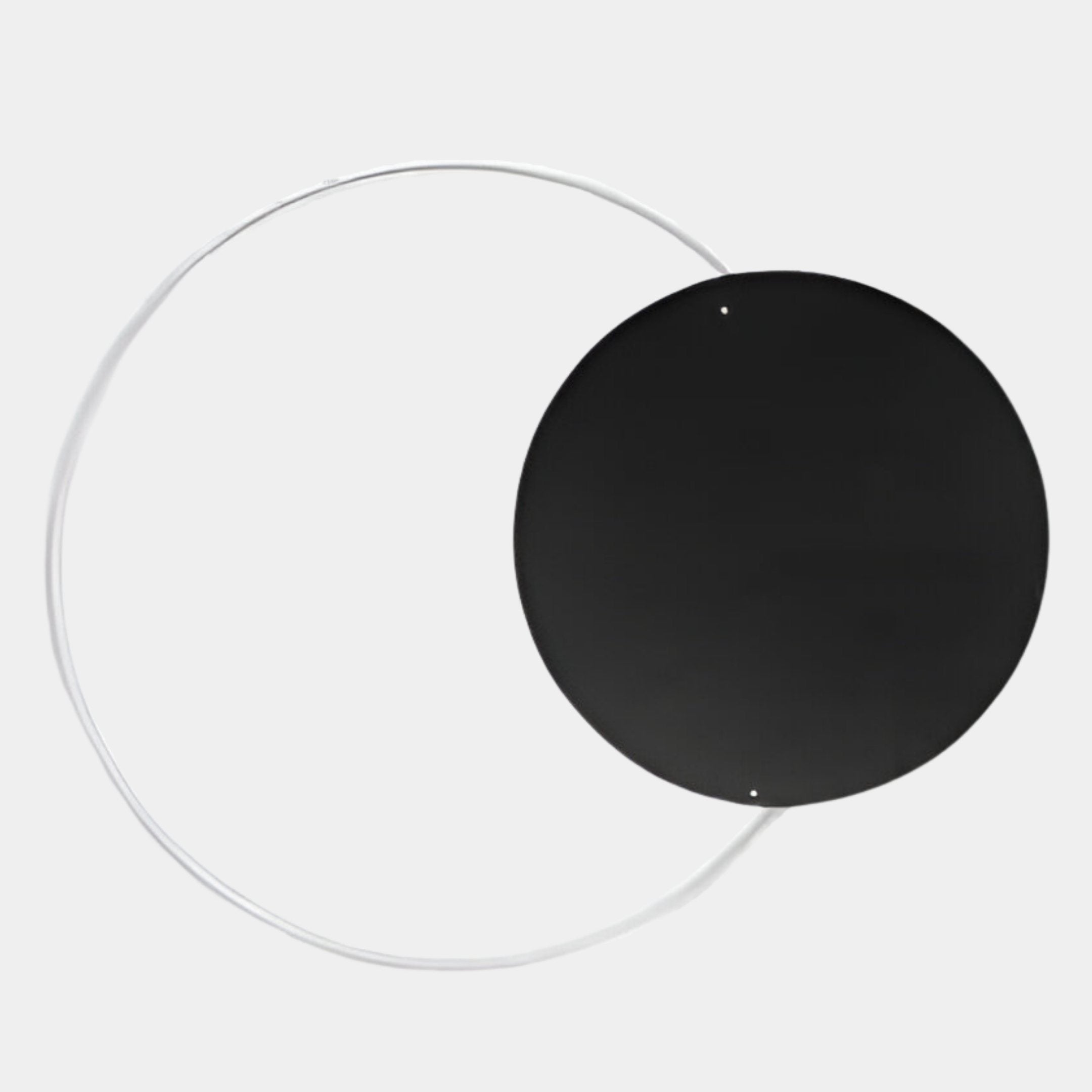 The Soluna Onyx Acrylic 3D LED Wall Art by Giant Sculptures features a large black acrylic circle overlapping a thin white wire circle on a light gray background, creating a minimalist abstract design perfect for dual lighting effects.