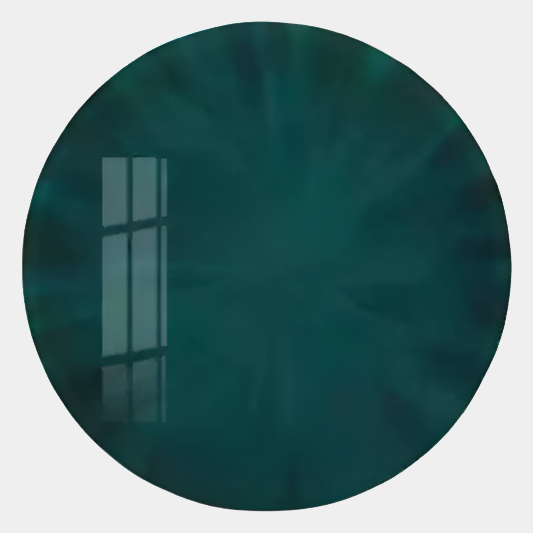 A round, deep teal gemstone, inspired by Giant Sculptures Lumea Deep Green 3D LED Crystal Porcelain Wall Art, radiates nature-inspired elegance with a glossy surface reflecting a window grid and bright highlights on a white background.