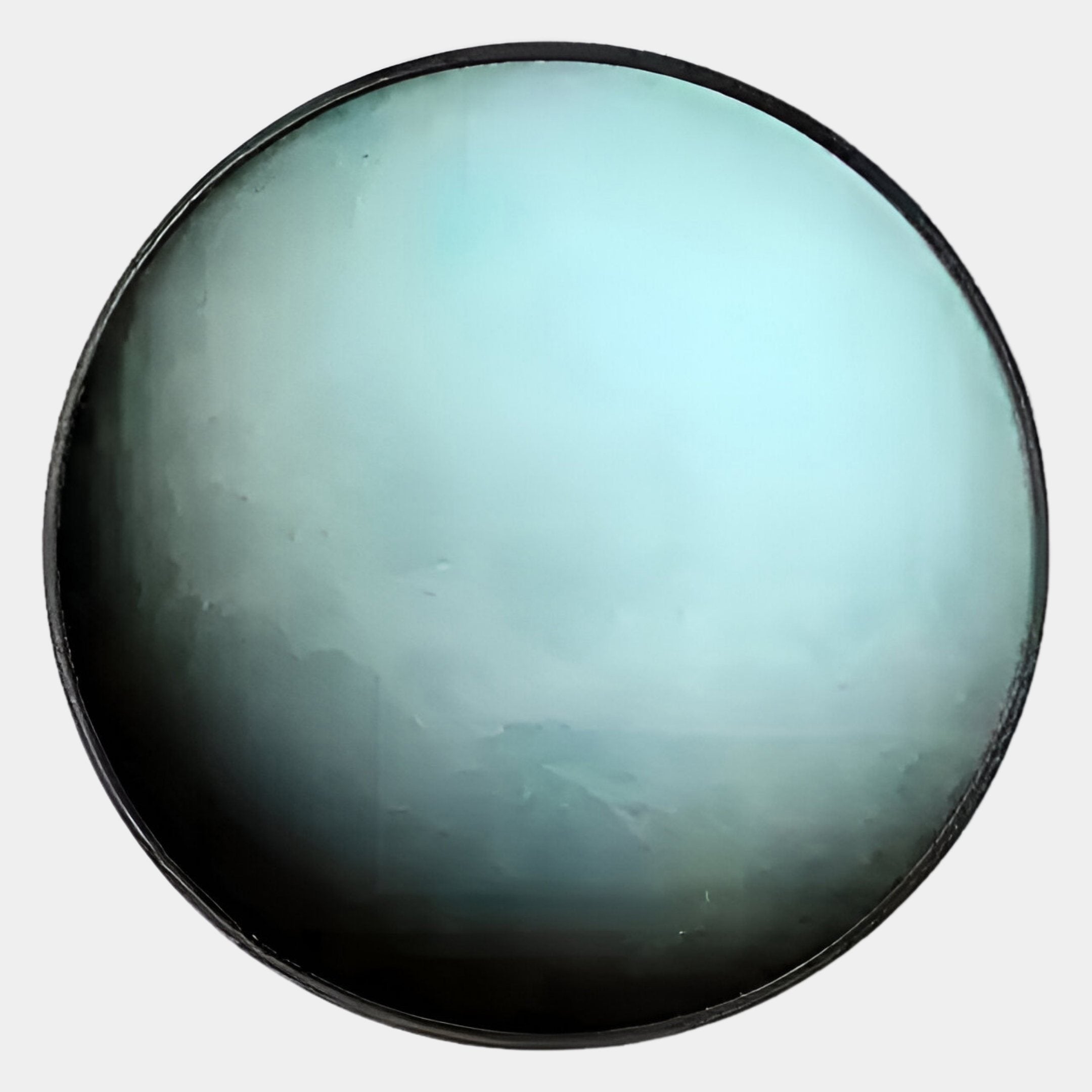 A close-up of the Galaxia Uranus Crystal Porcelain LED Wall Art by Giant Sculptures shows a circular, glossy surface with pale blue to dark gray gradients, evoking celestial beauty like an ethereal lens or polished stone.