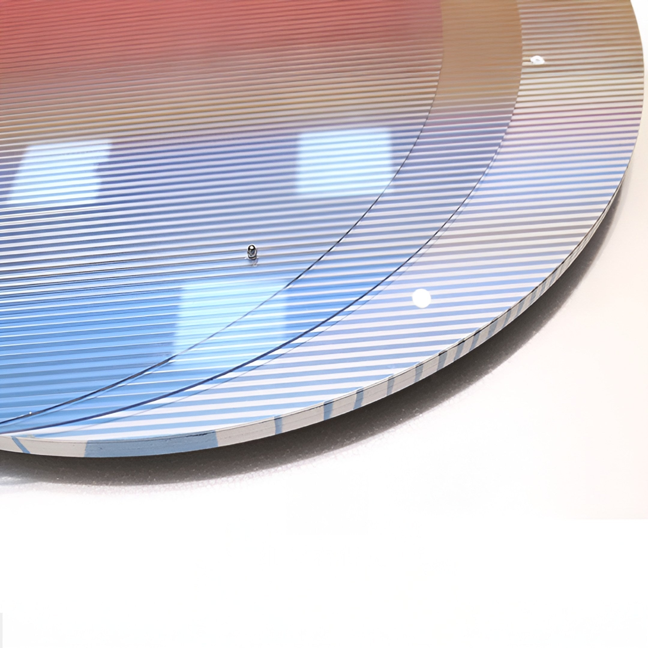 Close-up of a reflective surface with fine lines and blue, white, and reddish gradients—partially shown with a shiny finish and a small screw—reminiscent of the Chromia Sunrise Glow Acrylic 3D LED Wall Art by Giant Sculptures with vibrant LED lighting.