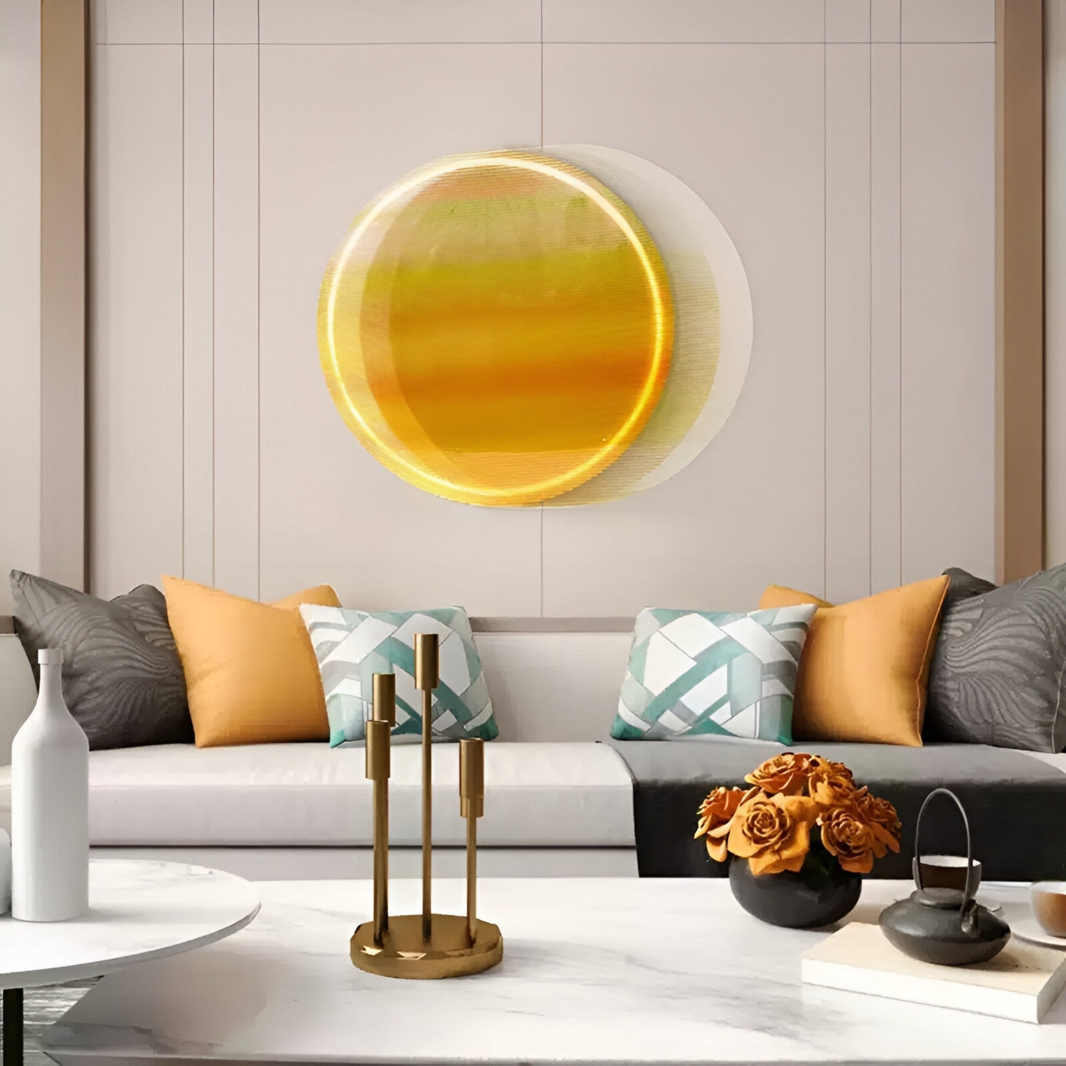 A modern living room with a white sofa, yellow and gray pillows, and the Chromia Golden Horizon Acrylic 3DLED Wall Art by Giant Sculptures, plus a white vase, gold candleholder, and orange roses on a marble coffee table.