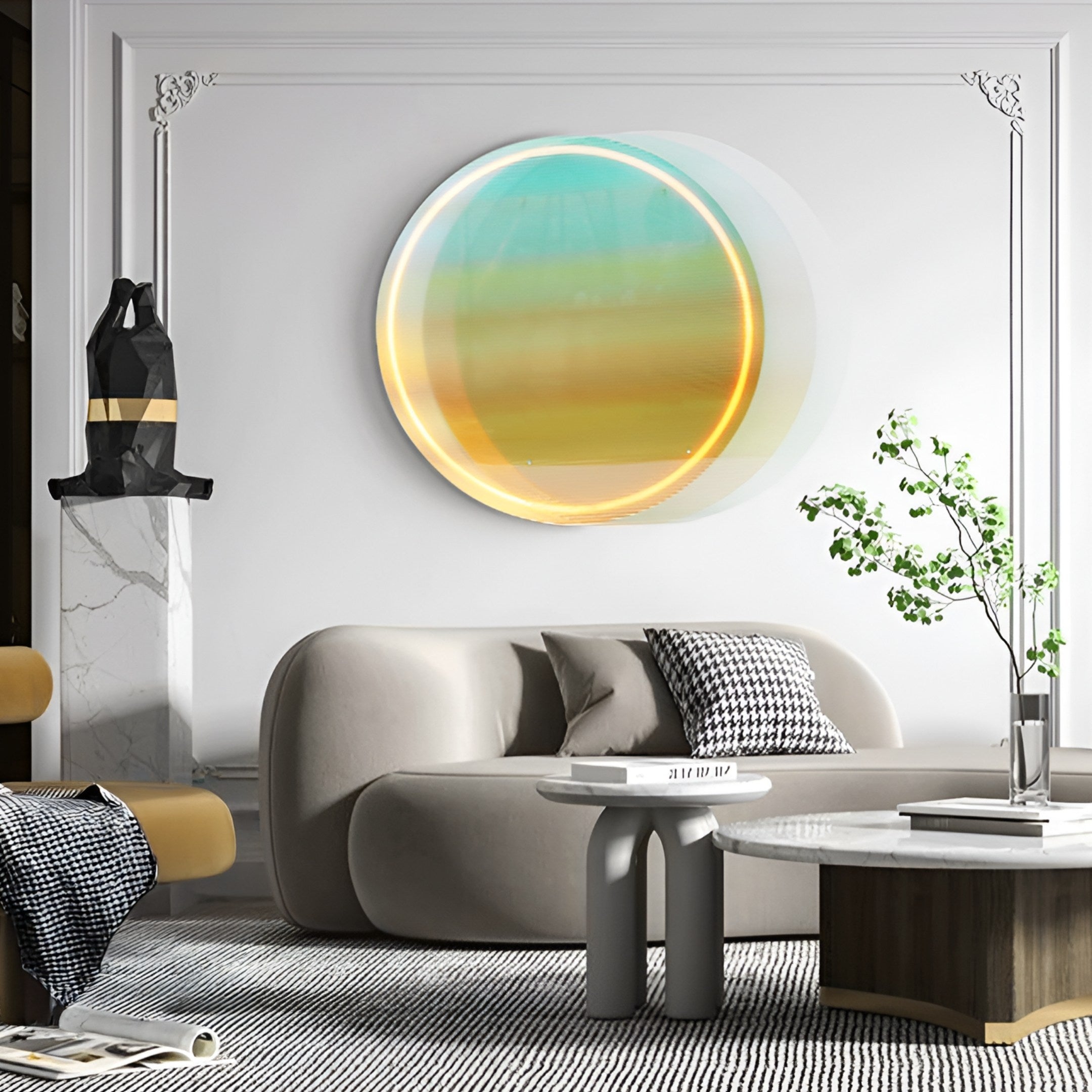 A modern living room featuring a rounded beige sofa, geometric cushions, a Giant Sculptures Chromia Tropical Dawn Acrylic 3D LED Wall Art in yellow and teal, a small tree on the coffee table, and decorative objects on a white mantle.