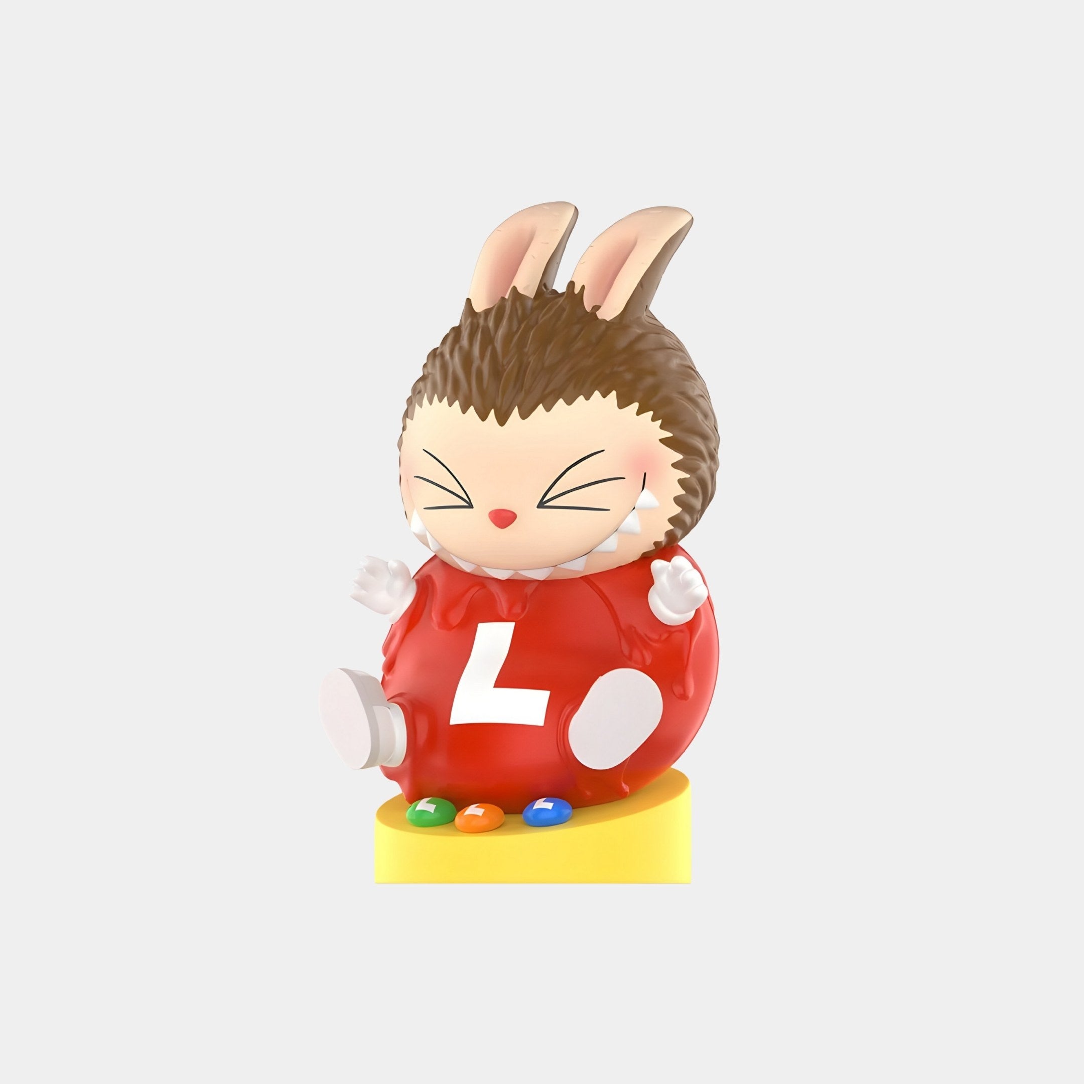 The L & L Chocolate Candy Labubu Figure (7-10cm) by Giant Sculptures features a cute, round Labubu with bunny ears, spiky brown head, red outfit with white L, and sits on a yellow base with colorful dots—a perfect collectible.
