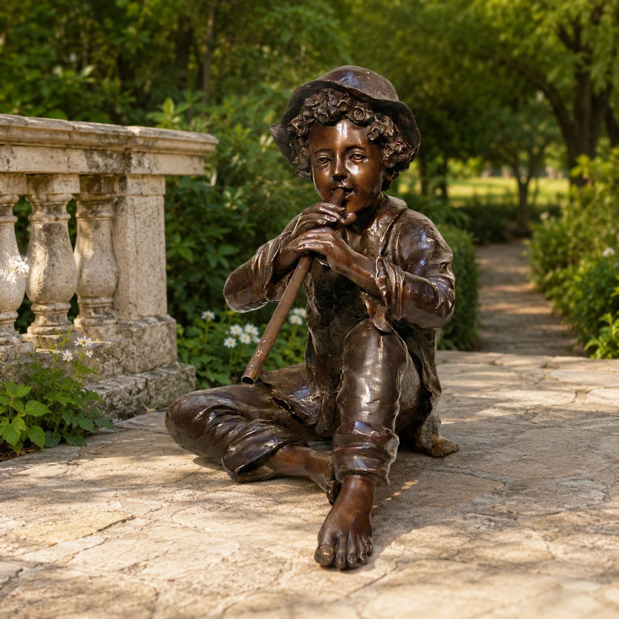 Life-Size Classical Seated Boy Playing Flute Bronze Sculpture, 130cm, shown barefoot and cross-legged on a stone garden path beside a balustrade, playing a flute.