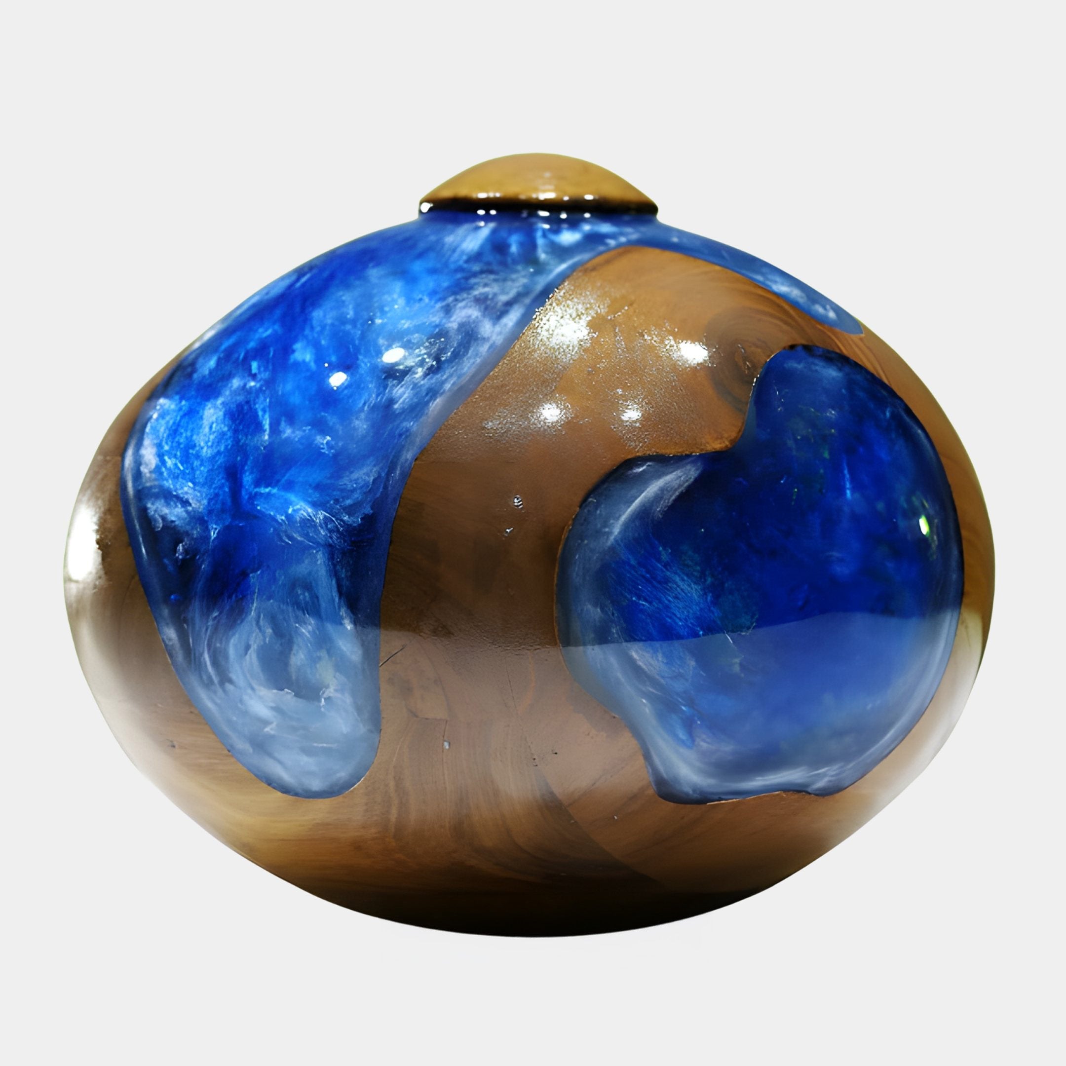 Globe Blue Resin Wood Vase 36cm by Giant Sculptures, a rounded honey-tan wood sphere with deep blue resin pools and a small top knob, on a white background.