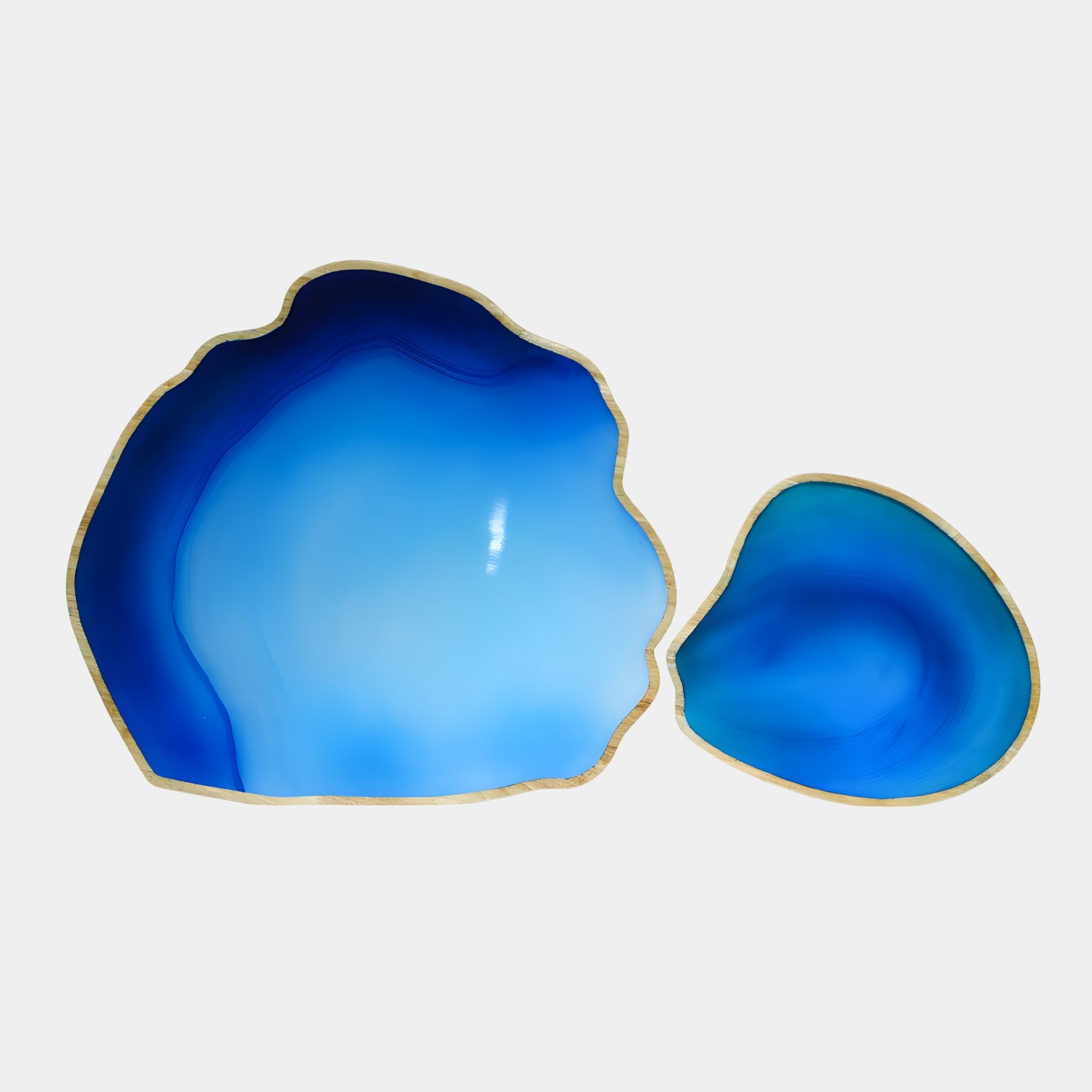 Lagoon Drift Blue Resin Wood Bowl set of two from Giant Sculptures, top-down view showing pale wood rims and glossy cobalt to sky-blue resin interiors.